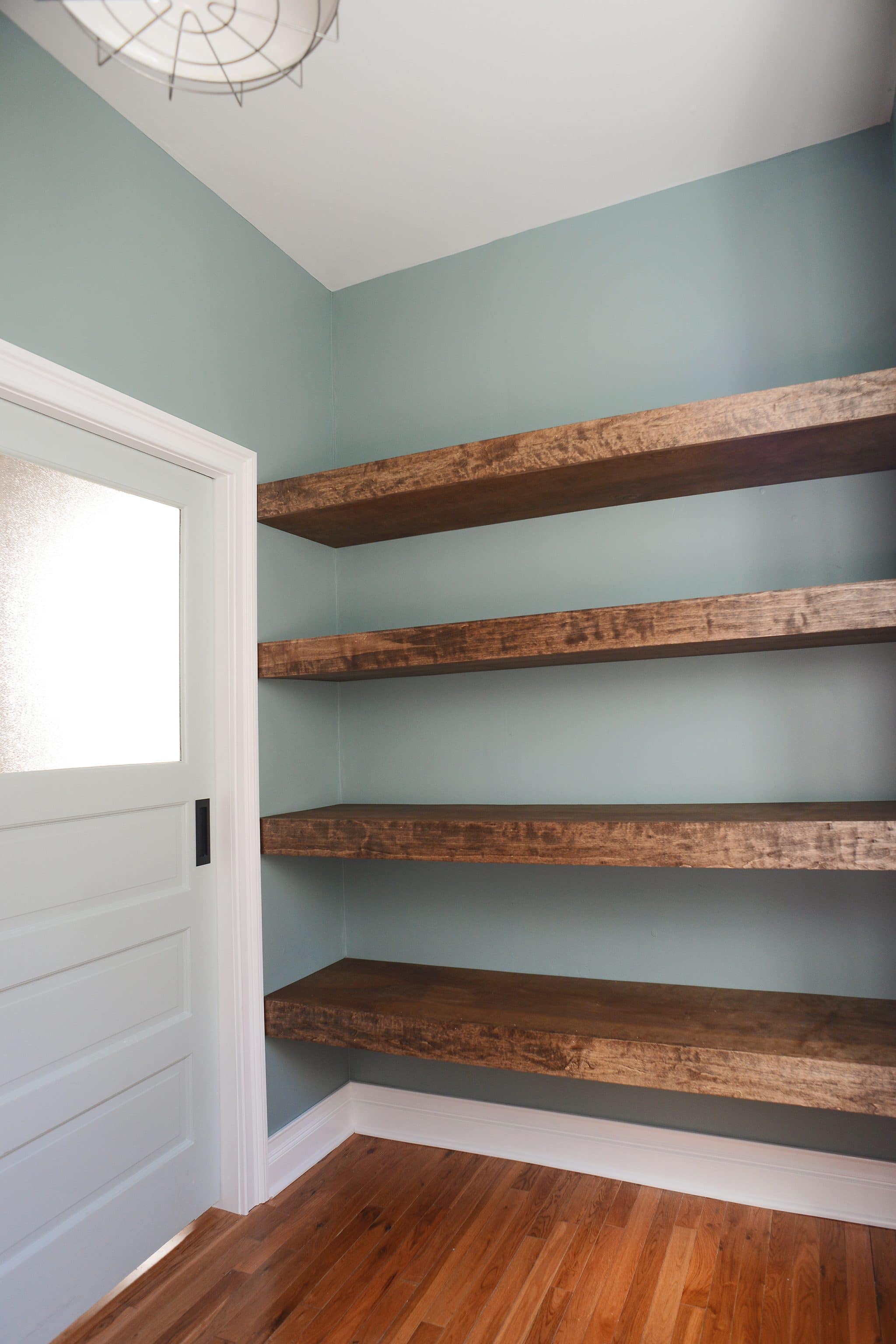 Our chunky floating shelves installed! | head to Yellow Brick Home for the step-by-step floating shelf tutorial!