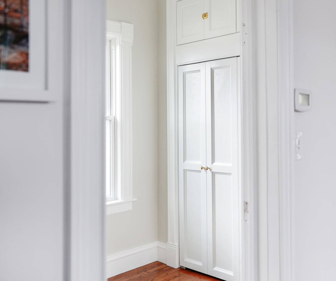 A view of our custom bi-fold doors, looking into Lucy's future nursery | via Yellow Brick Home