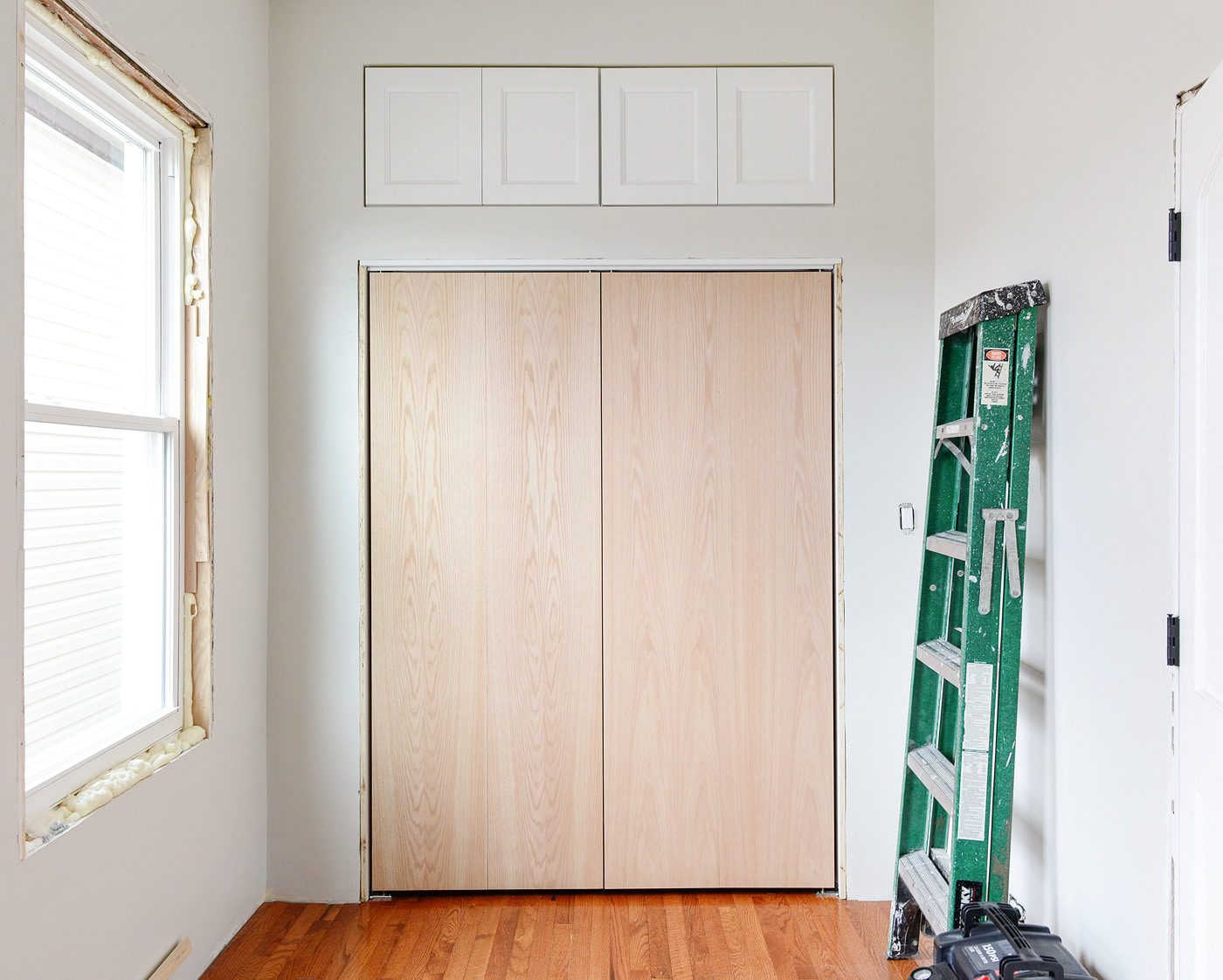 in-progress shot of our bi-fold doors with custom molding | via Yellow Brick Home