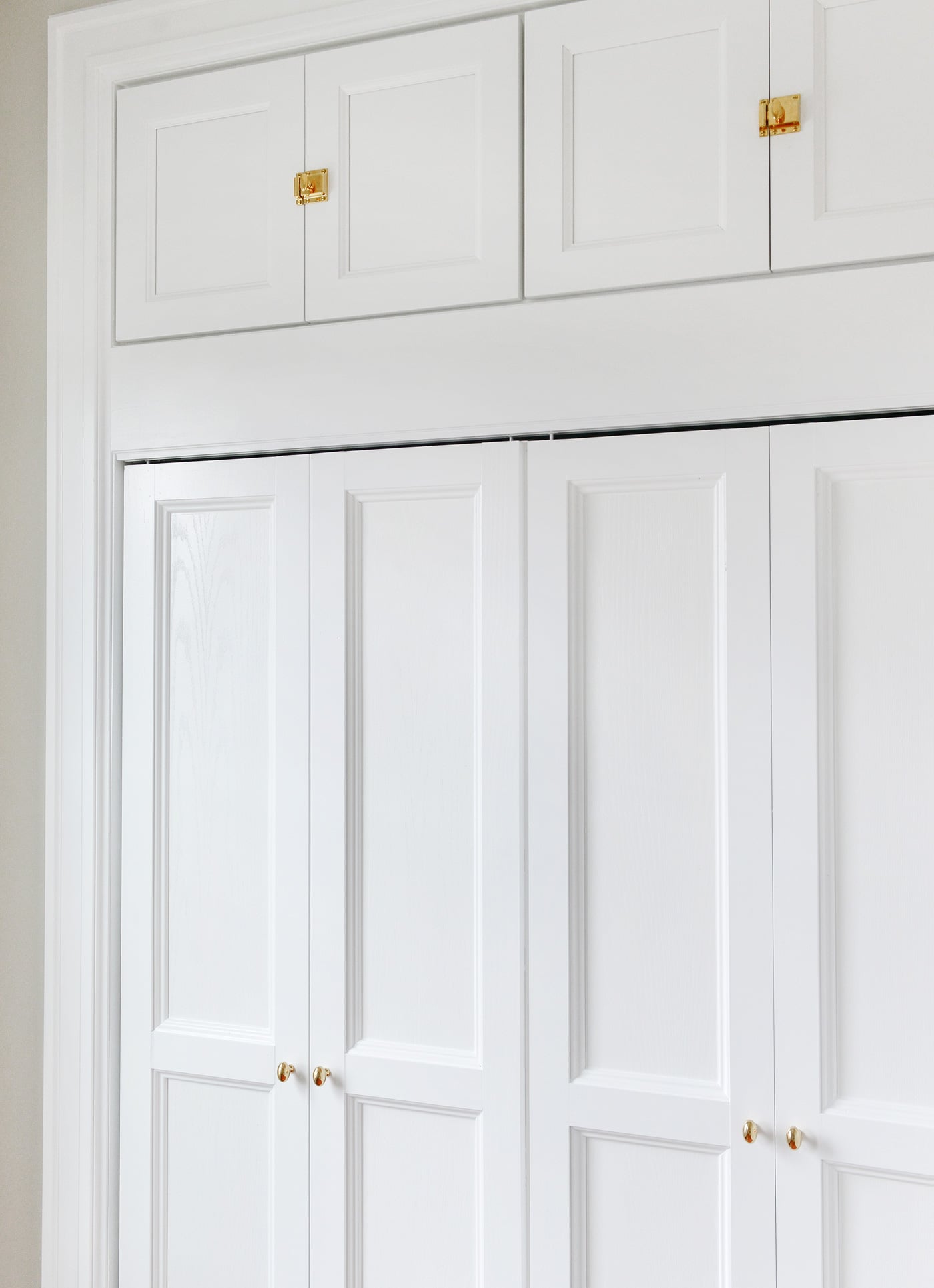 detail of custom molding on bi-fold doors | via Yellow Brick Home