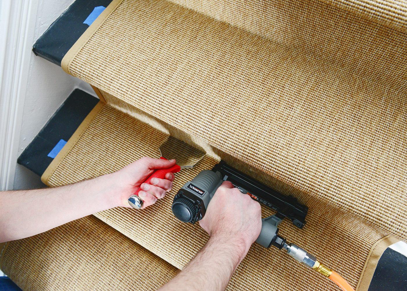 A bolster chisel and nailer are key to installing a stair runner | How to Install a Stair Runner in 10 Steps via Yellow Brick Home