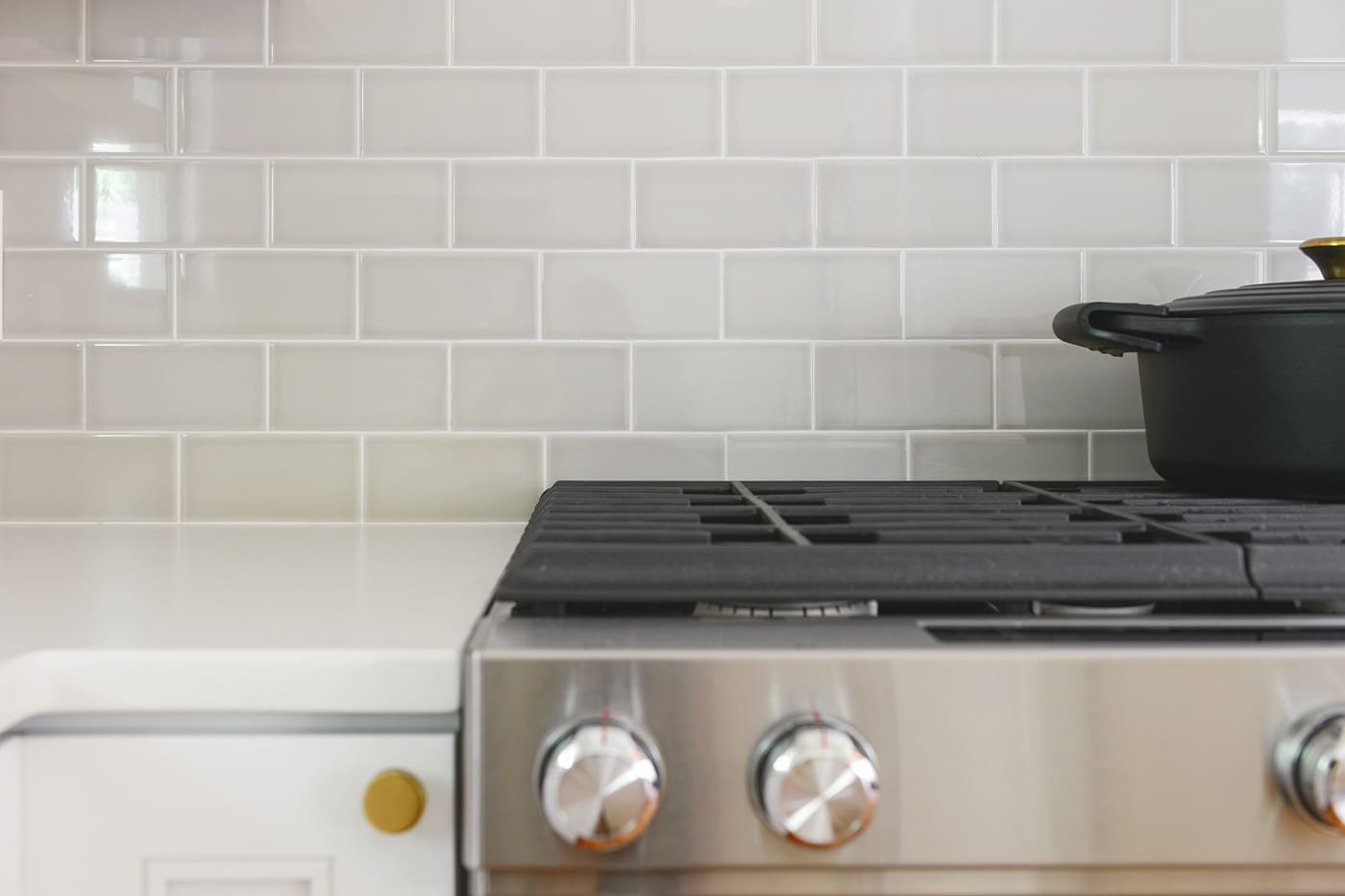 How-to tile a kitchen backsplash. We promise you can do it yourself! Plus, we're sharing a video tutorial where we walk you through the process from start to finish. // via Yellow Brick Home
