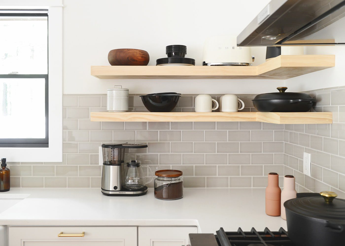 Our kitchen with greige tile, floating shelves and white countertops | The Weekender: My Skin care Routine, a Podcast to Love and Our Queen Anne Home - Yellow Brick Home