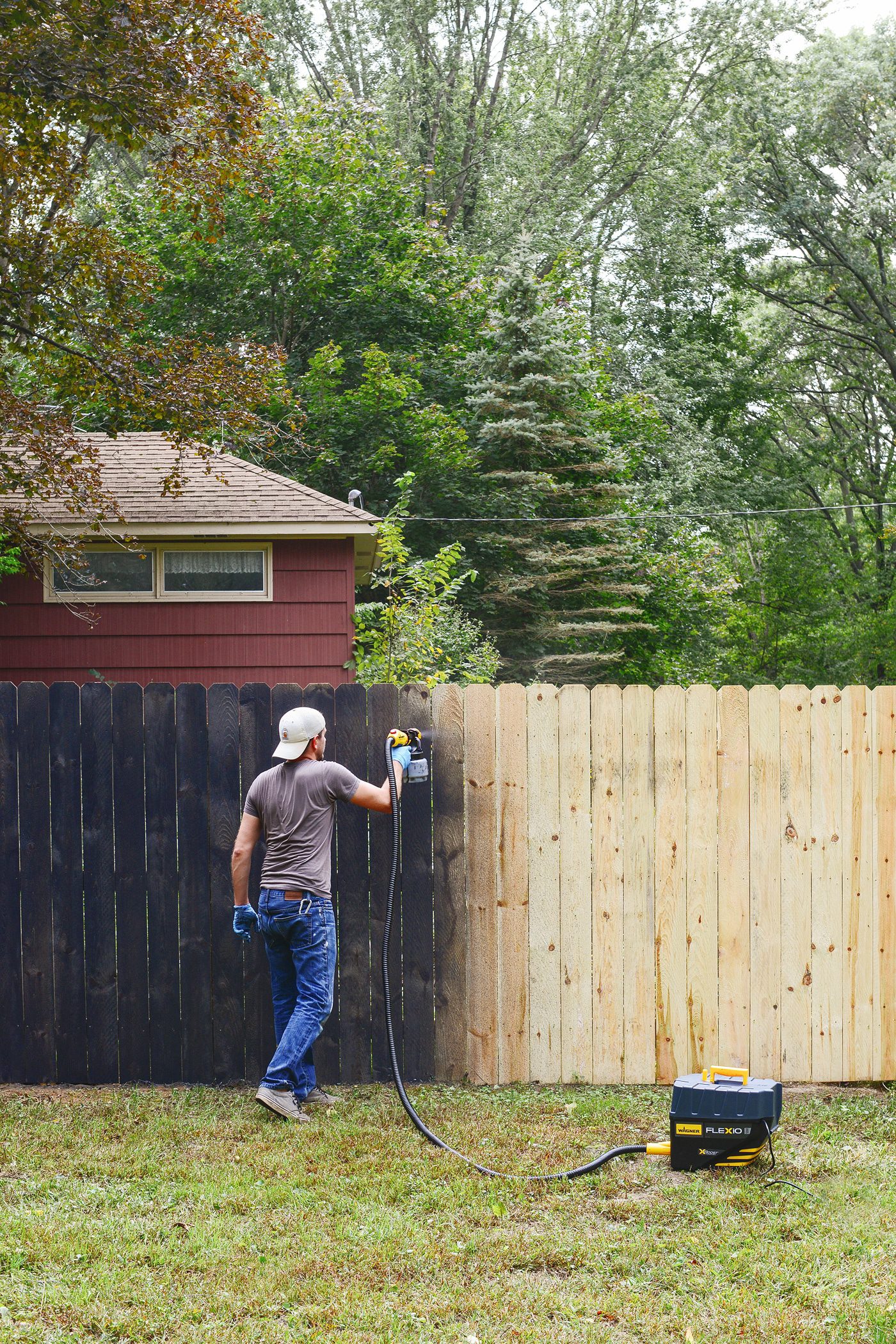 How we stained our fence black! via Yellow Brick Home