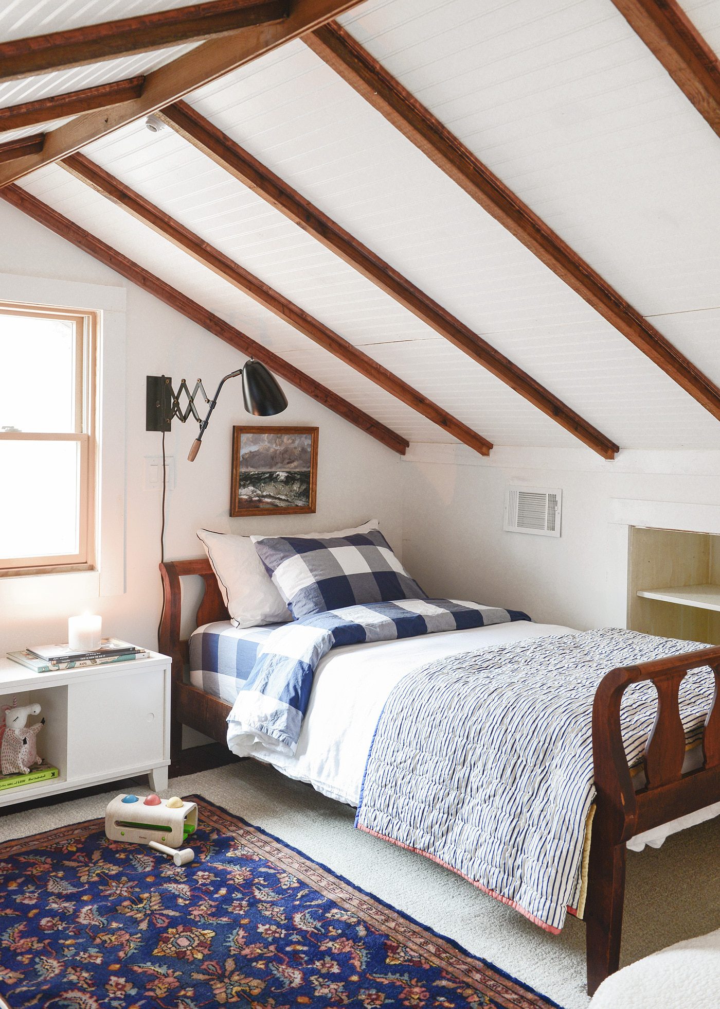A cozy kids' sleeping loft // cabin loft // beam ceilings // via Yellow Brick Home