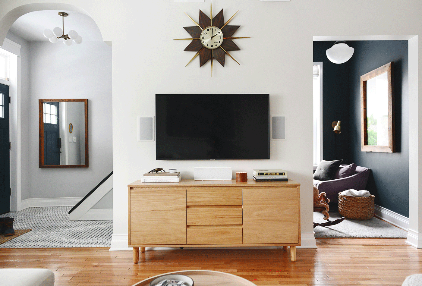 Mid century media console in neutral living room // How to keep media console organized // via Yellow Brick Home