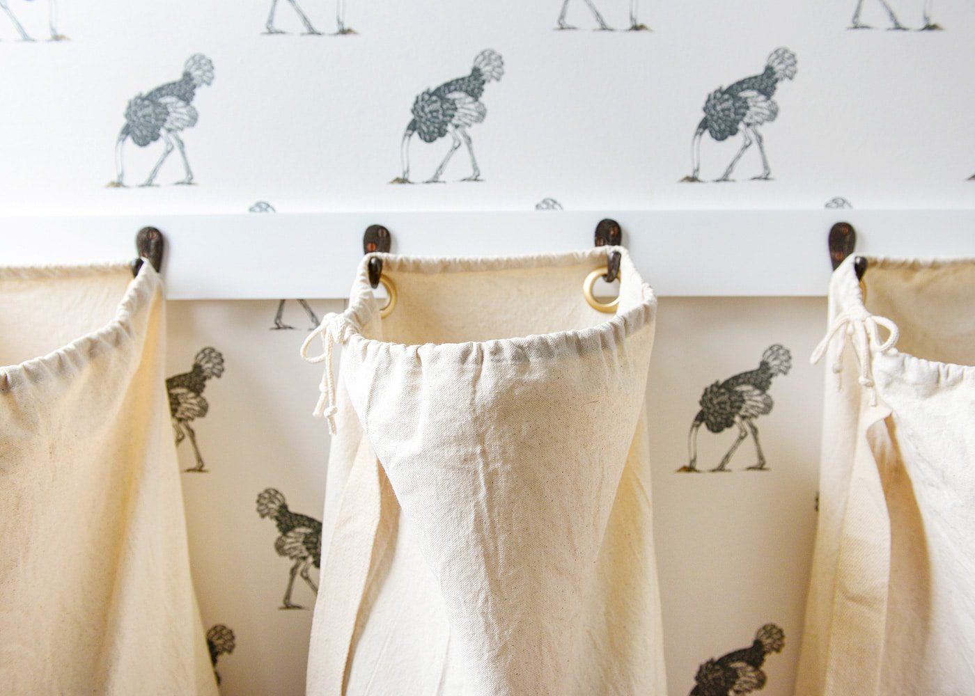 DIY laundry sorting bags using grommets and hooks