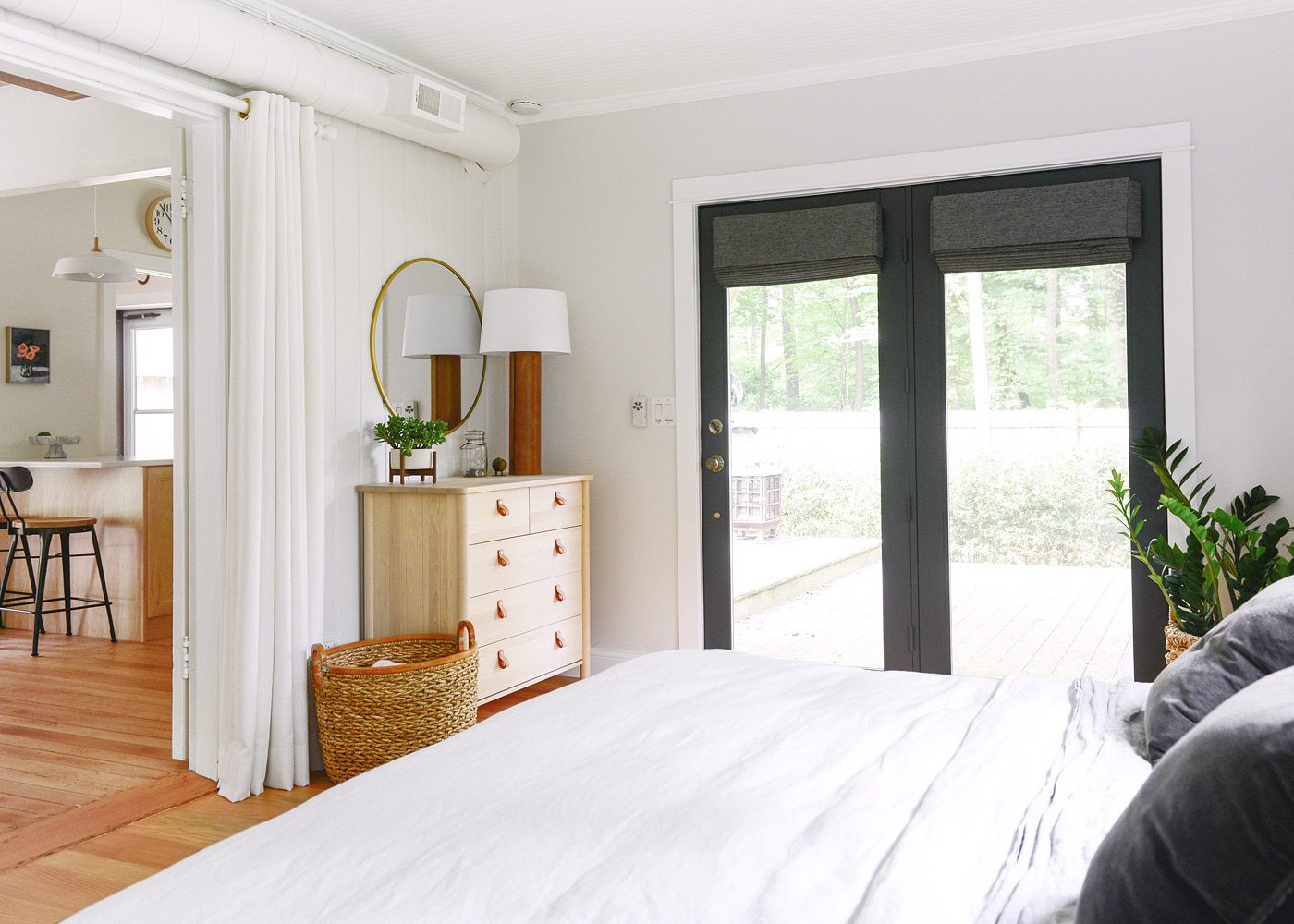 The primary bedroom offers a king size bed and beautiful views of the surrounding forest. 