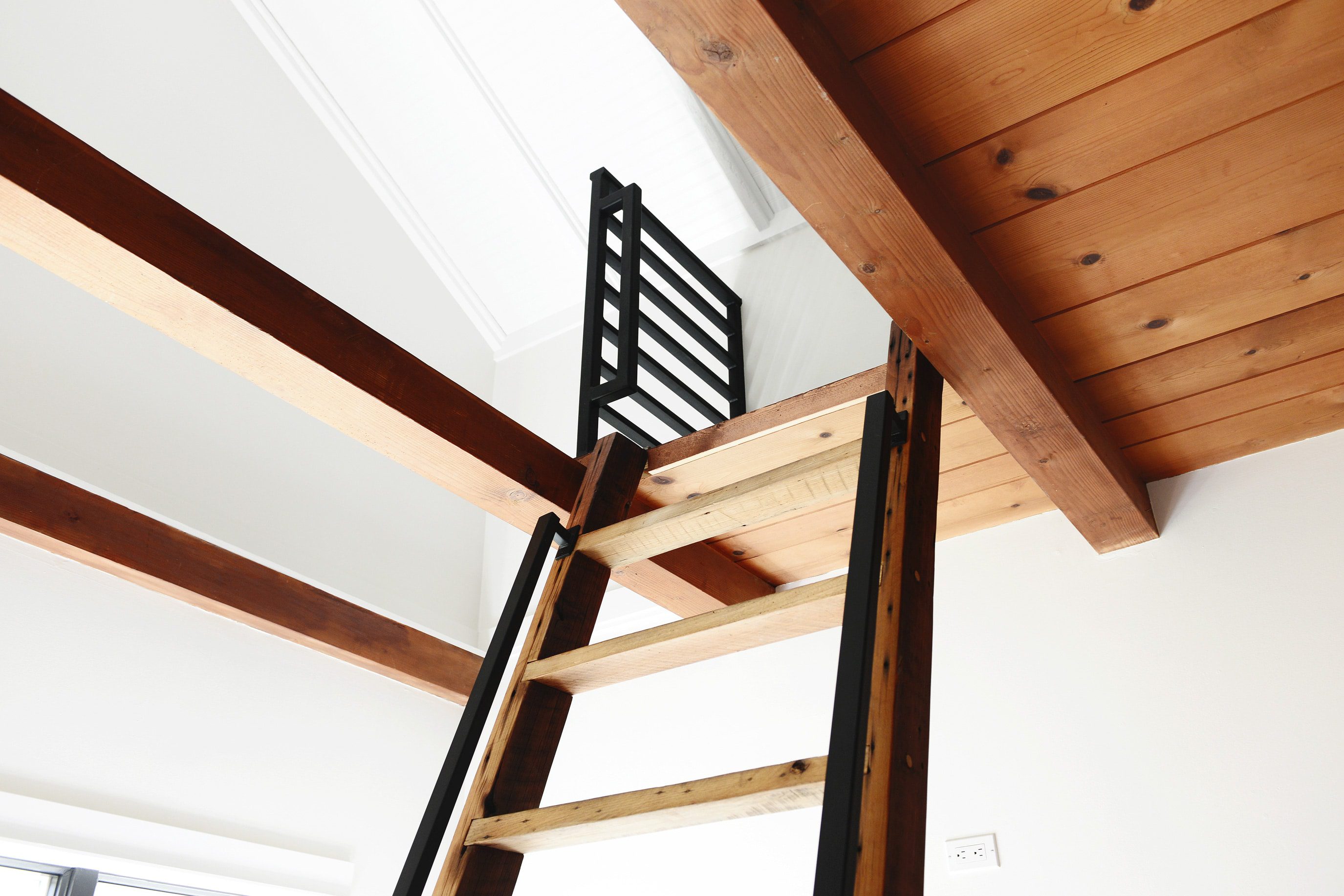 A modern horizontal railing for a kids' sleeping loft | lake house inspiration | via Yellow Brick Home