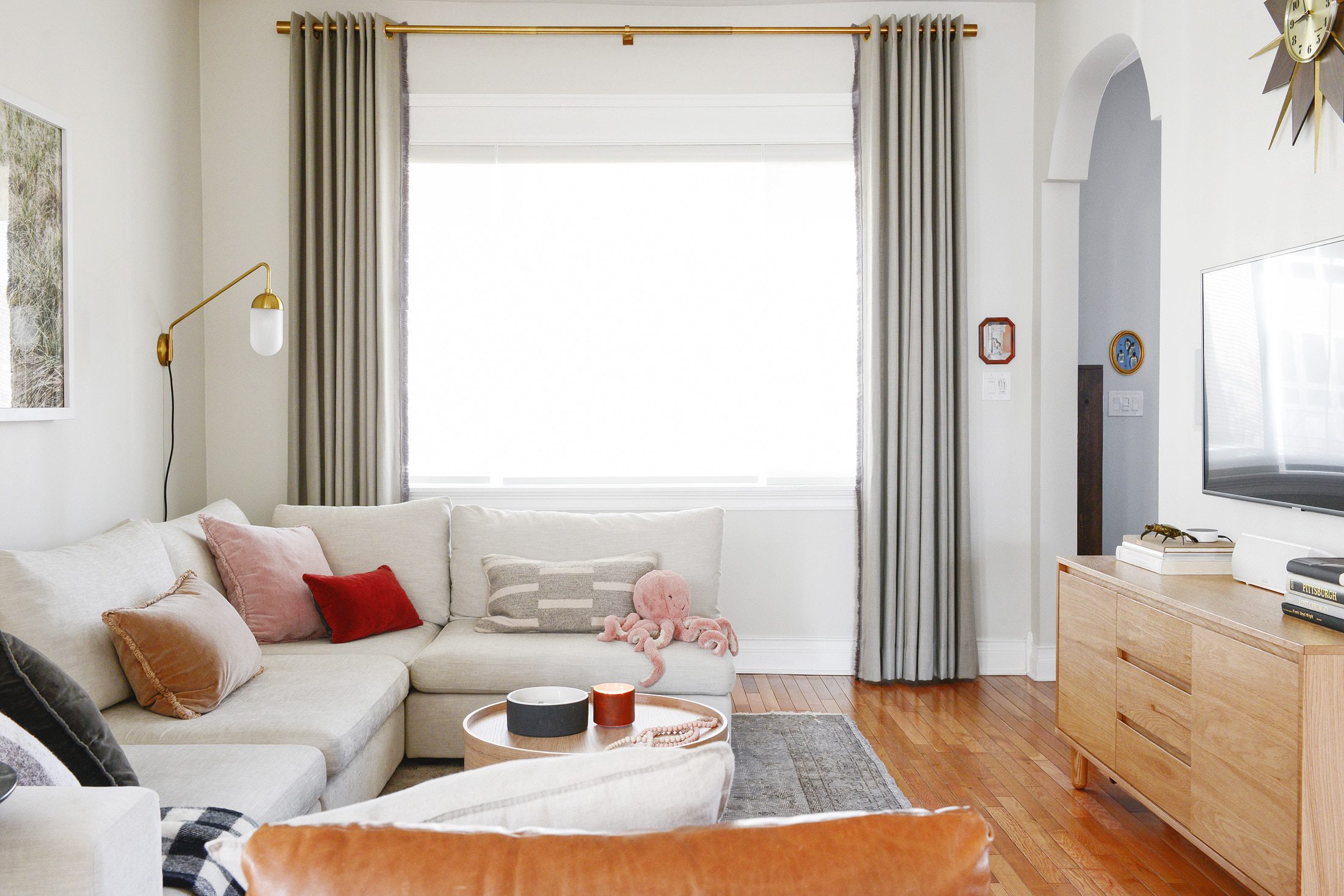 Custom drapery panels in a neutral living room // via Yellow Brick Home