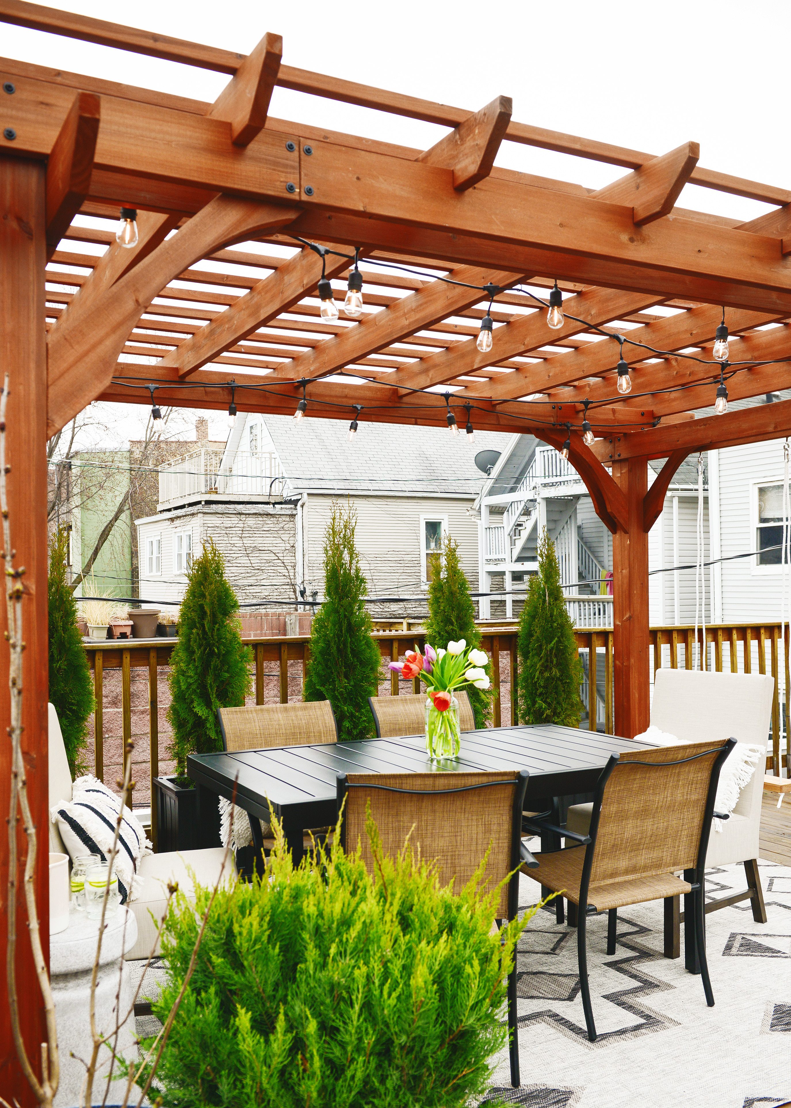 A rooftop pergola reveal using a kit from Lowe's! // via Yellow Brick Home