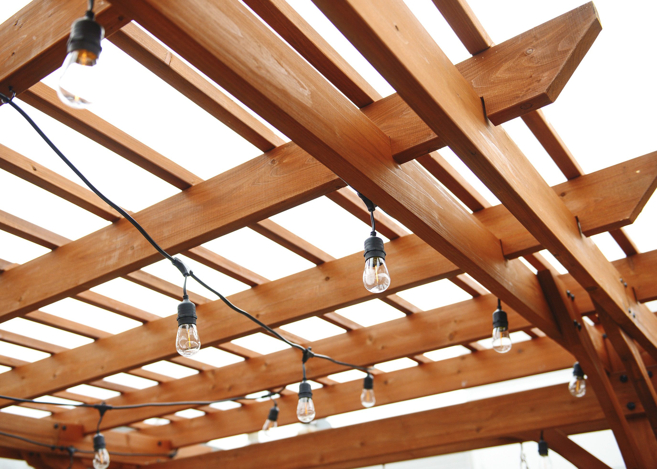 A rooftop pergola reveal using a kit from Lowe's! // via Yellow Brick Home