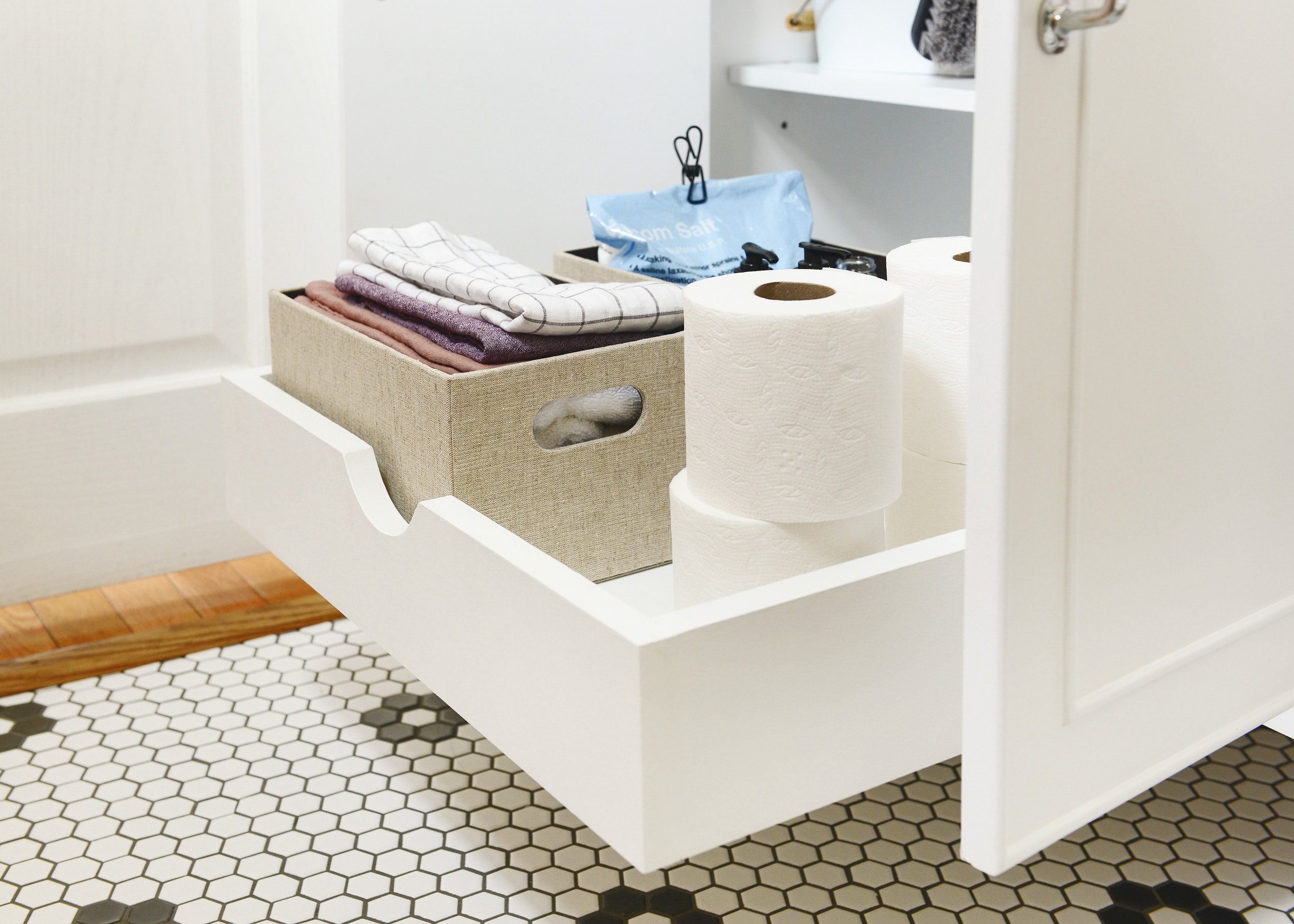 The custom sliding drawer in our Chicago guest bathroom // via Yellow Brick Home
