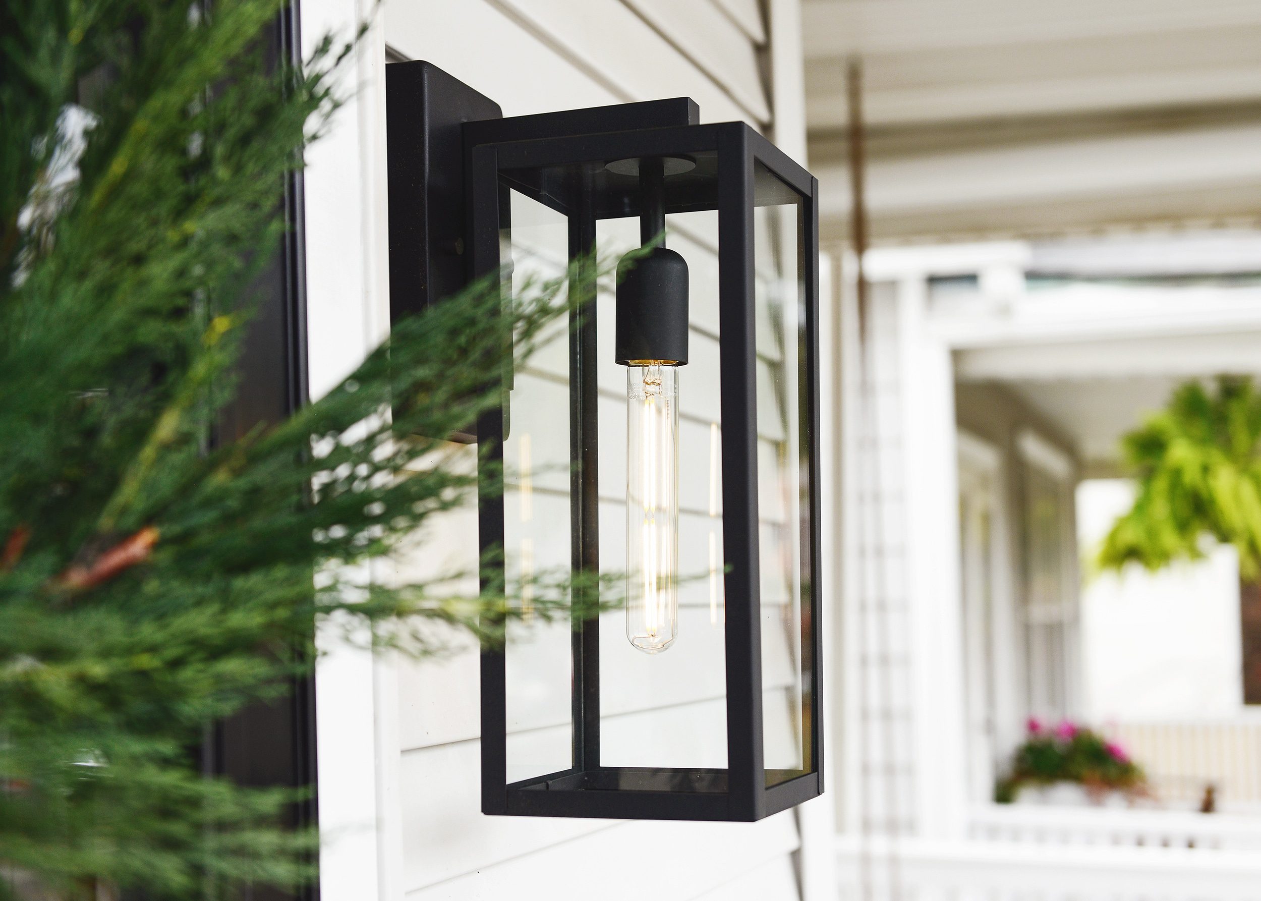 Affordable outdoor sconce, black metal and skinny LED: The 5 ingredients to a fall front porch refresh! via Yellow Brick Home
