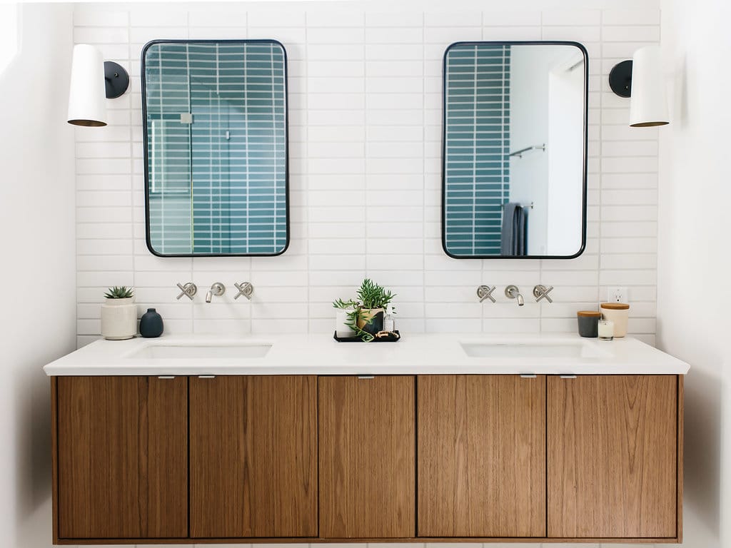 Bathroom with walnut credenza and two mirrors | Inspiration for Stacked Tile, stacked bond tile pattern, via Yellow Brick Home