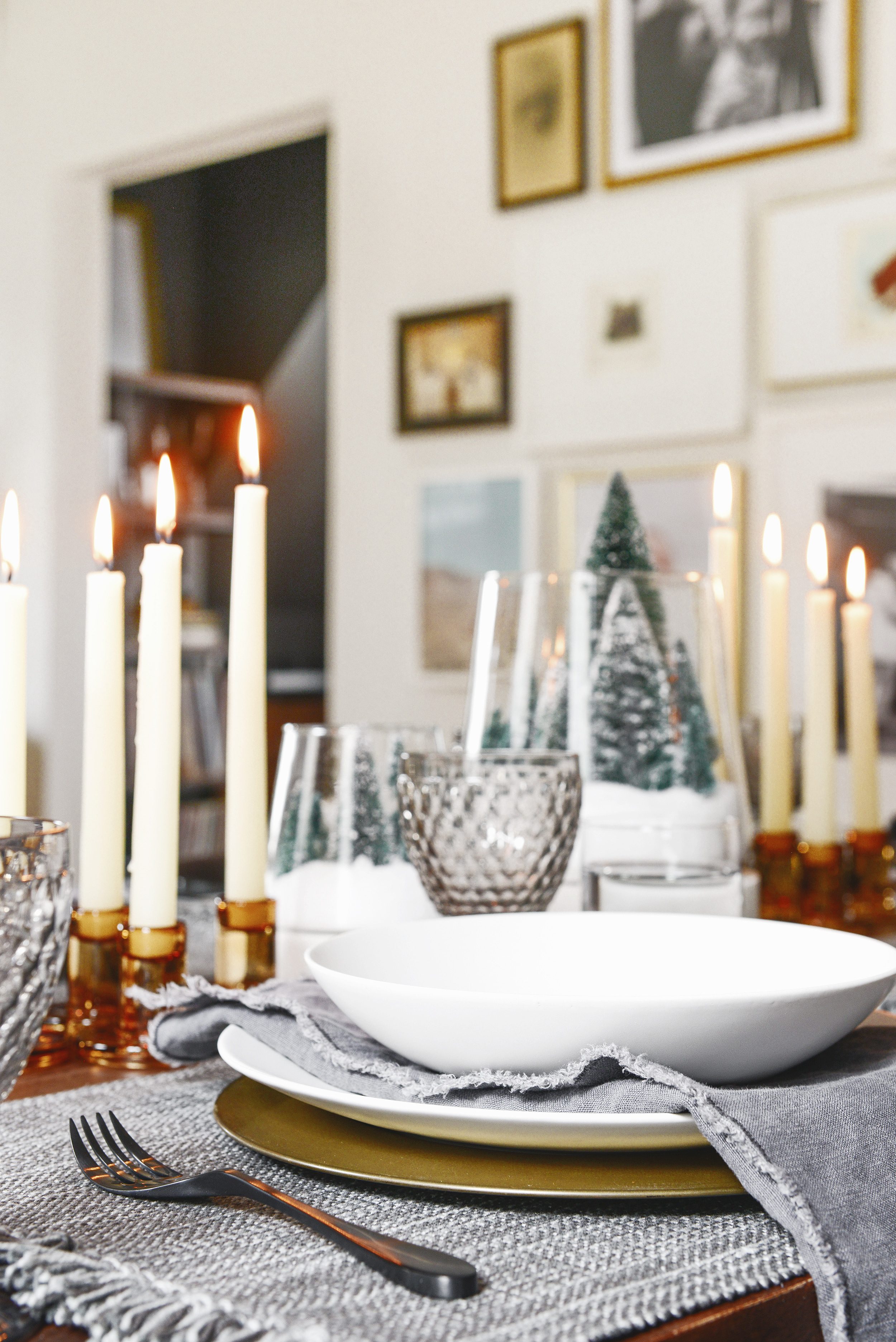A holiday table setting in shades of grey, amber and white | This holiday season, consider simplifying your table setting with these 5 fresh styling tips! | via Yellow Brick Home