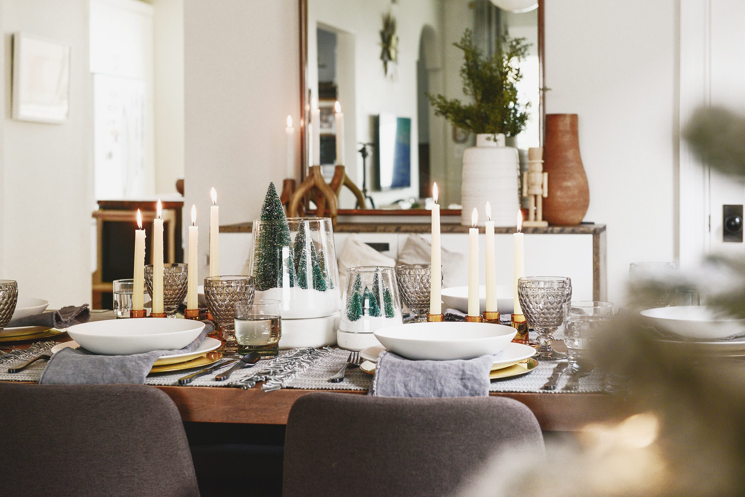 A holiday table setting in shades of grey, amber and white | This holiday season, consider simplifying your table setting with these 5 fresh styling tips! | via Yellow Brick Home