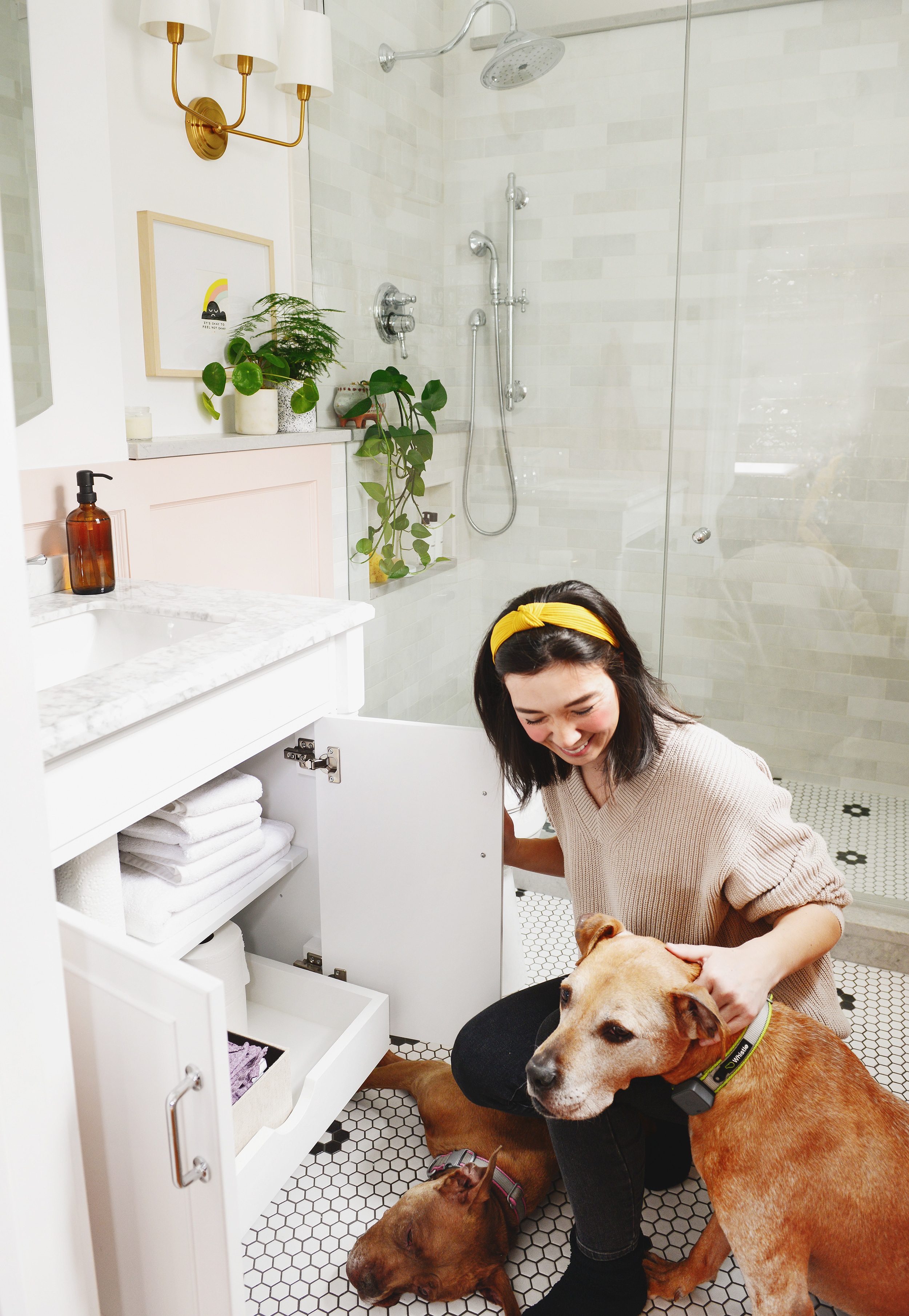 bathroom organization with my two dogs by my side | via Yellow Brick Home