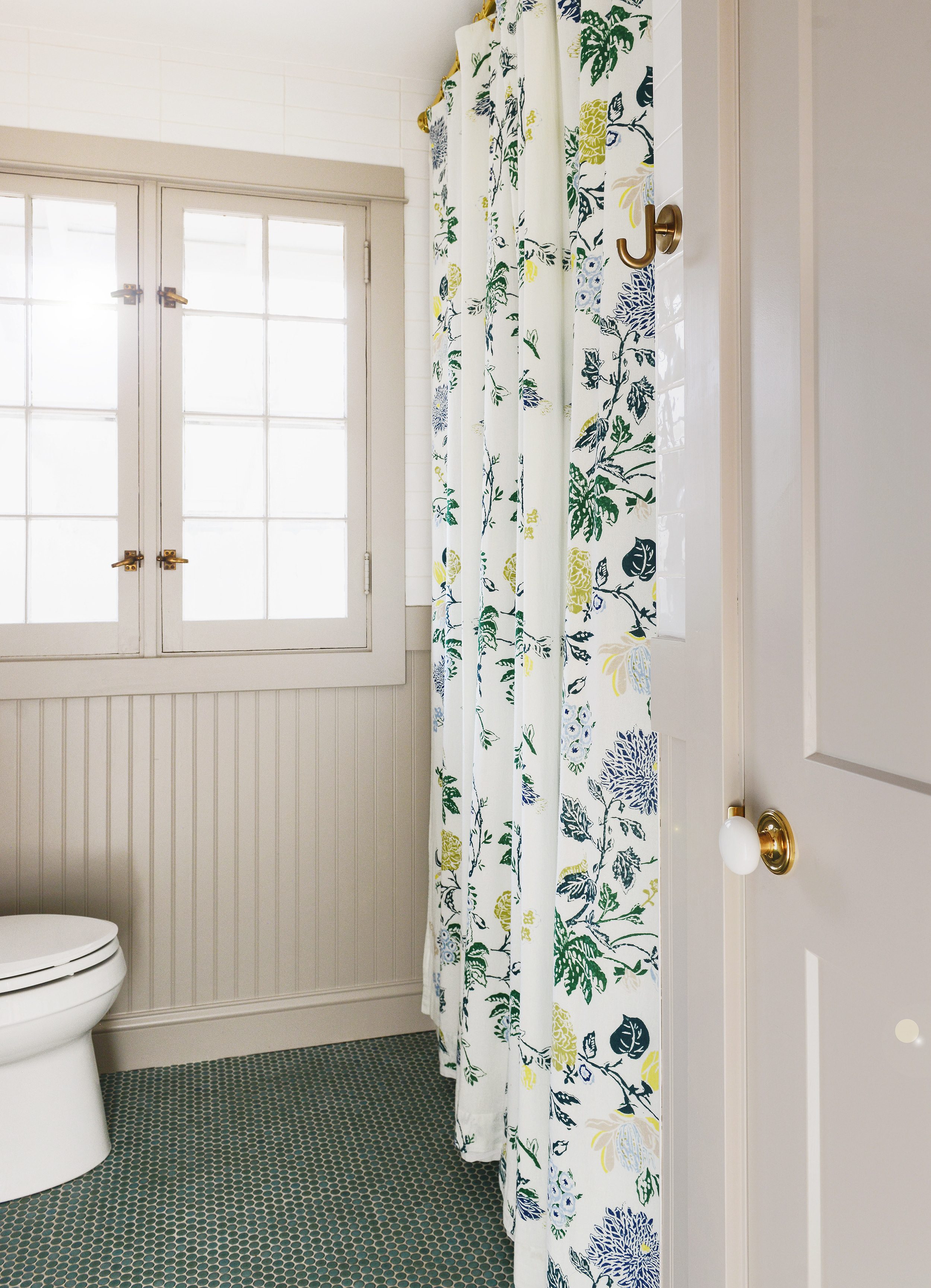 An extra long shower curtain using window panels sewn together | via Yellow Brick Home