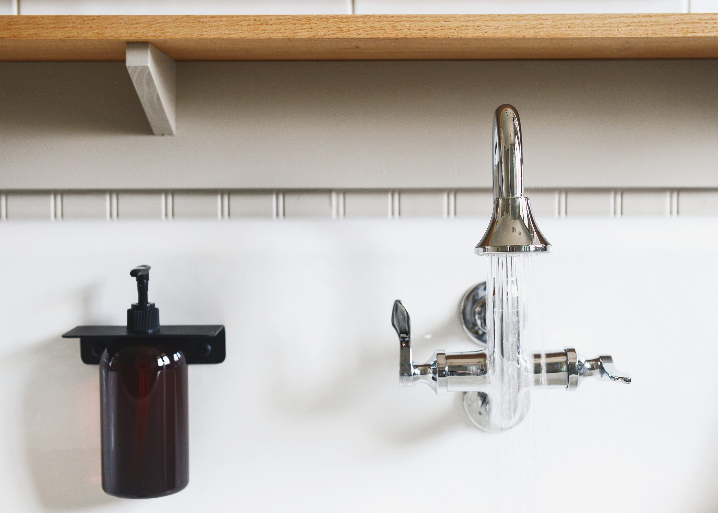 Kohler Brockway sink and Triton Bowe faucets in polished chrome | via Yellow Brick Home