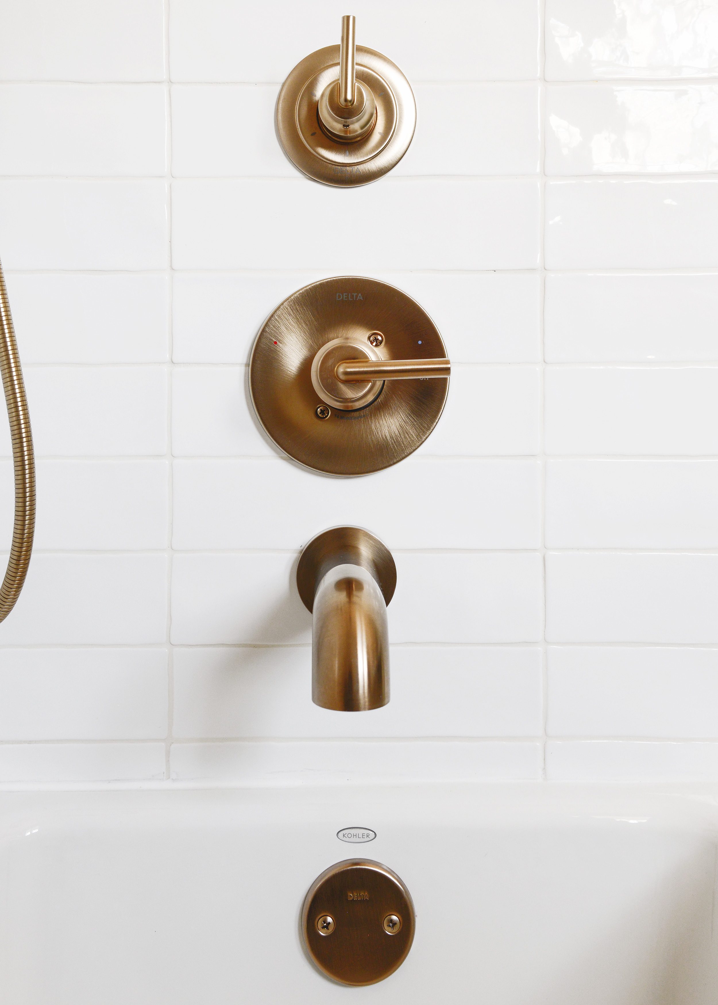 Delta Trinsic Champagne Bronze shower fixtures | via Yellow Brick Home #sponsored by Lowe's Home Improvement