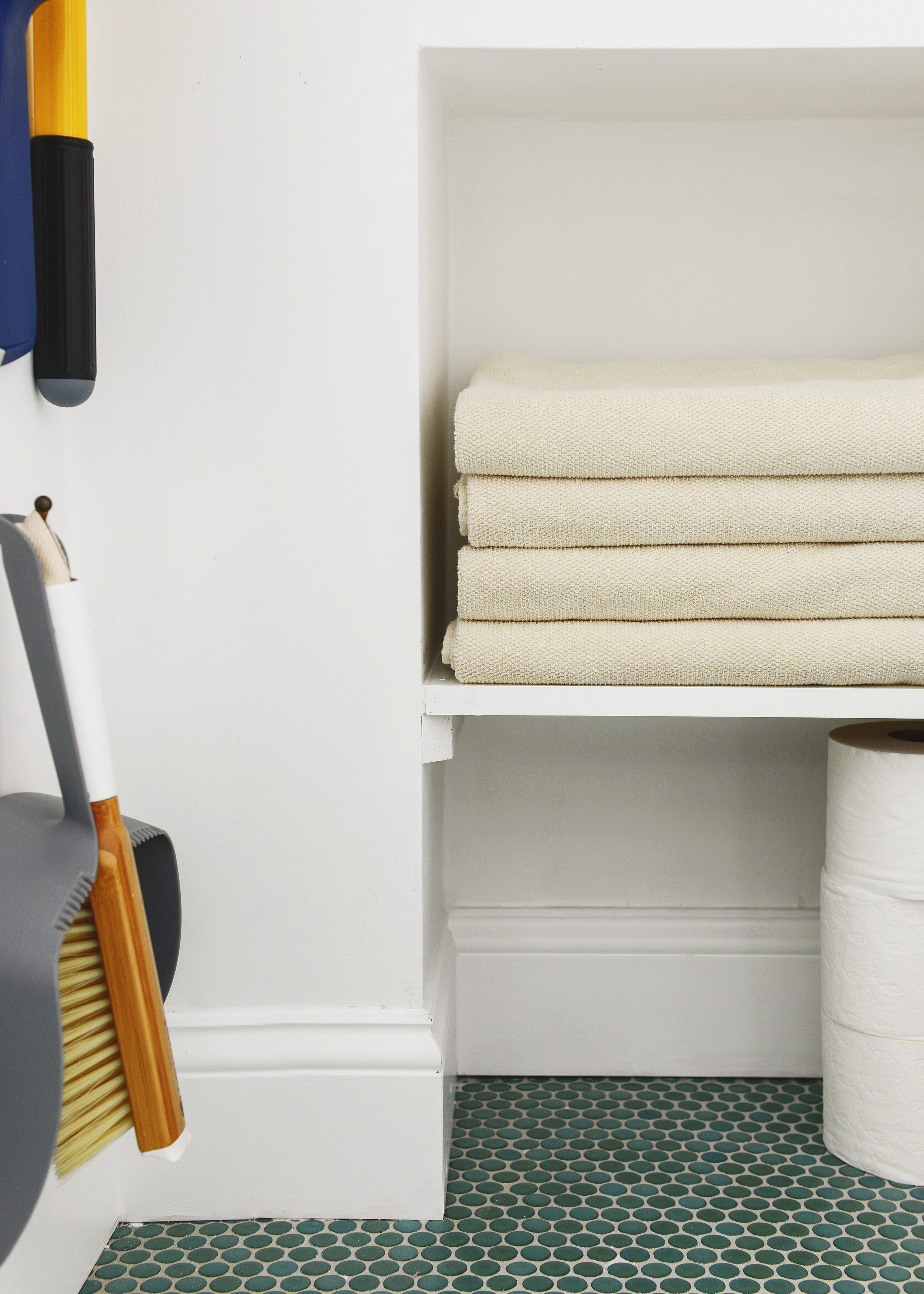 The finished interior of a small linen closet // via Yellow brick Home
