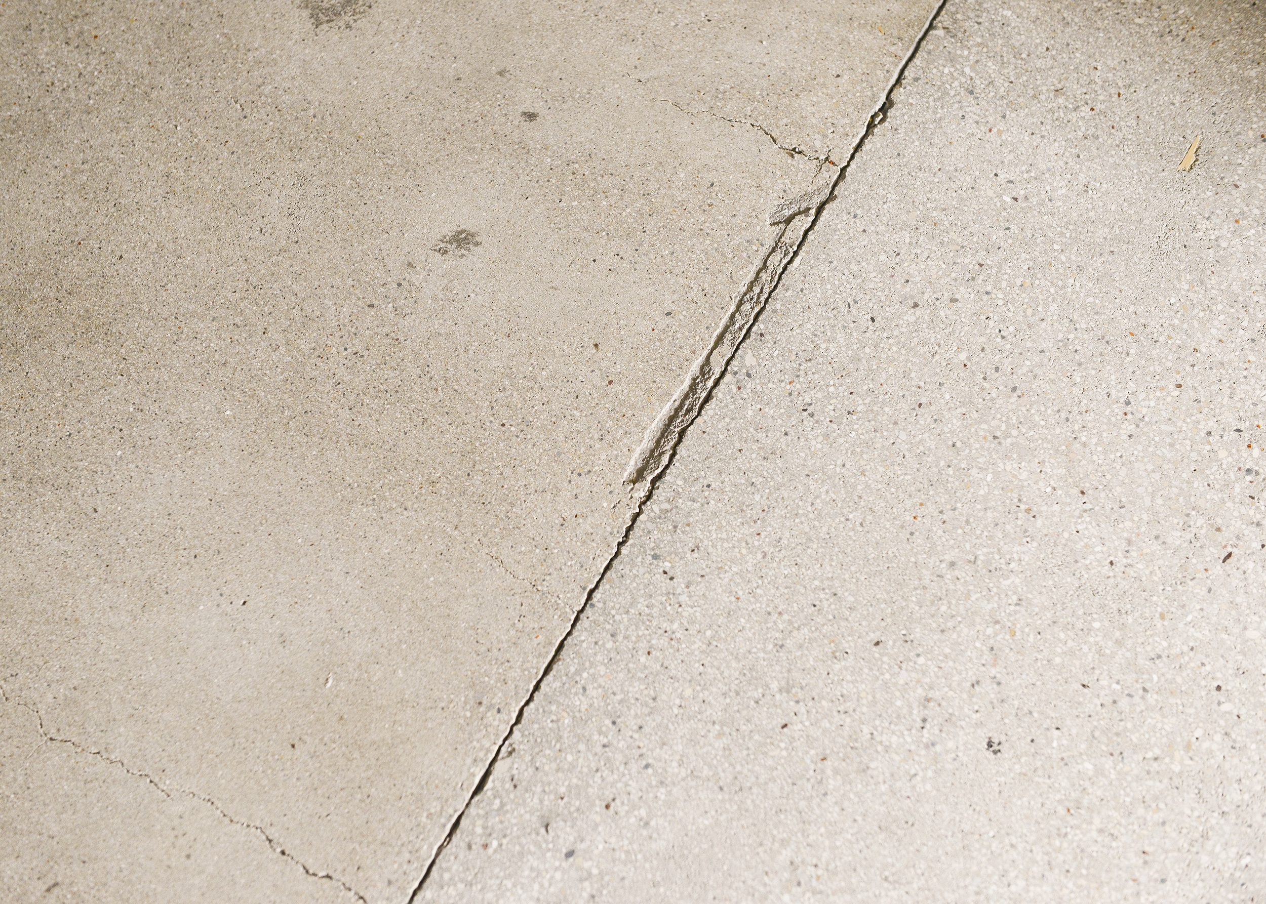 Unpolished concrete floors with imperfections | via Yellow Brick Home