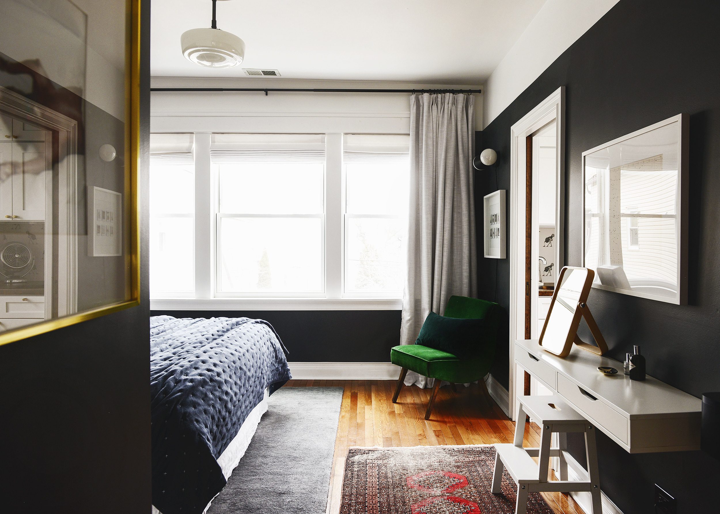 Best of Amazon via Yellow Brick Home - Bedroom Design! | Bedroom walls painted Benjamin Moore Raccoon Fur, navy bedding and a velvet green chair.