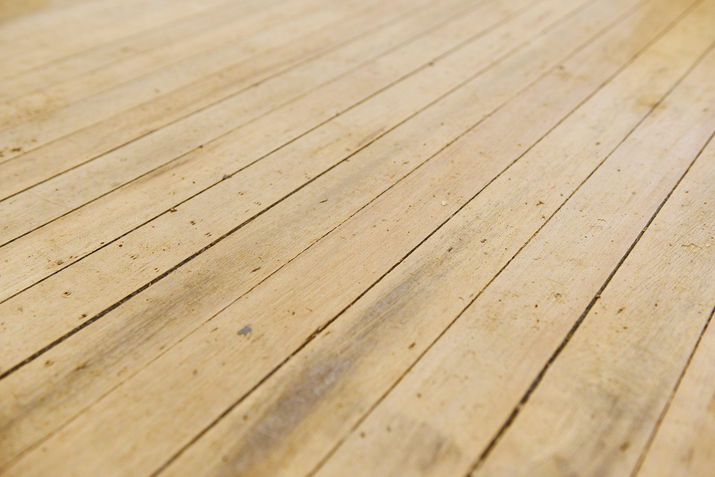 Refinished hardwood flooring after one stage of sanding // via Yellow Brick Home