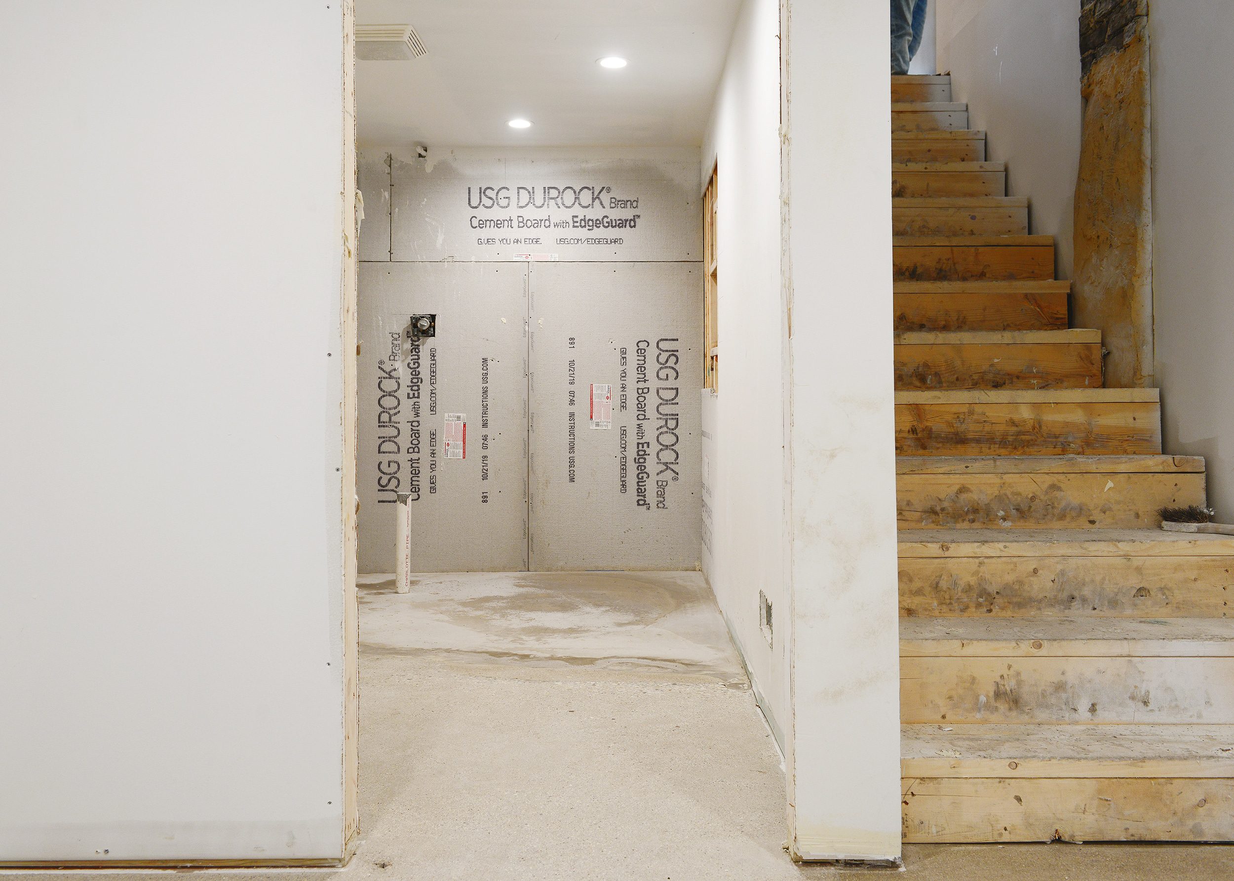 Polished concrete flooring in a remodeled basement apartment. 