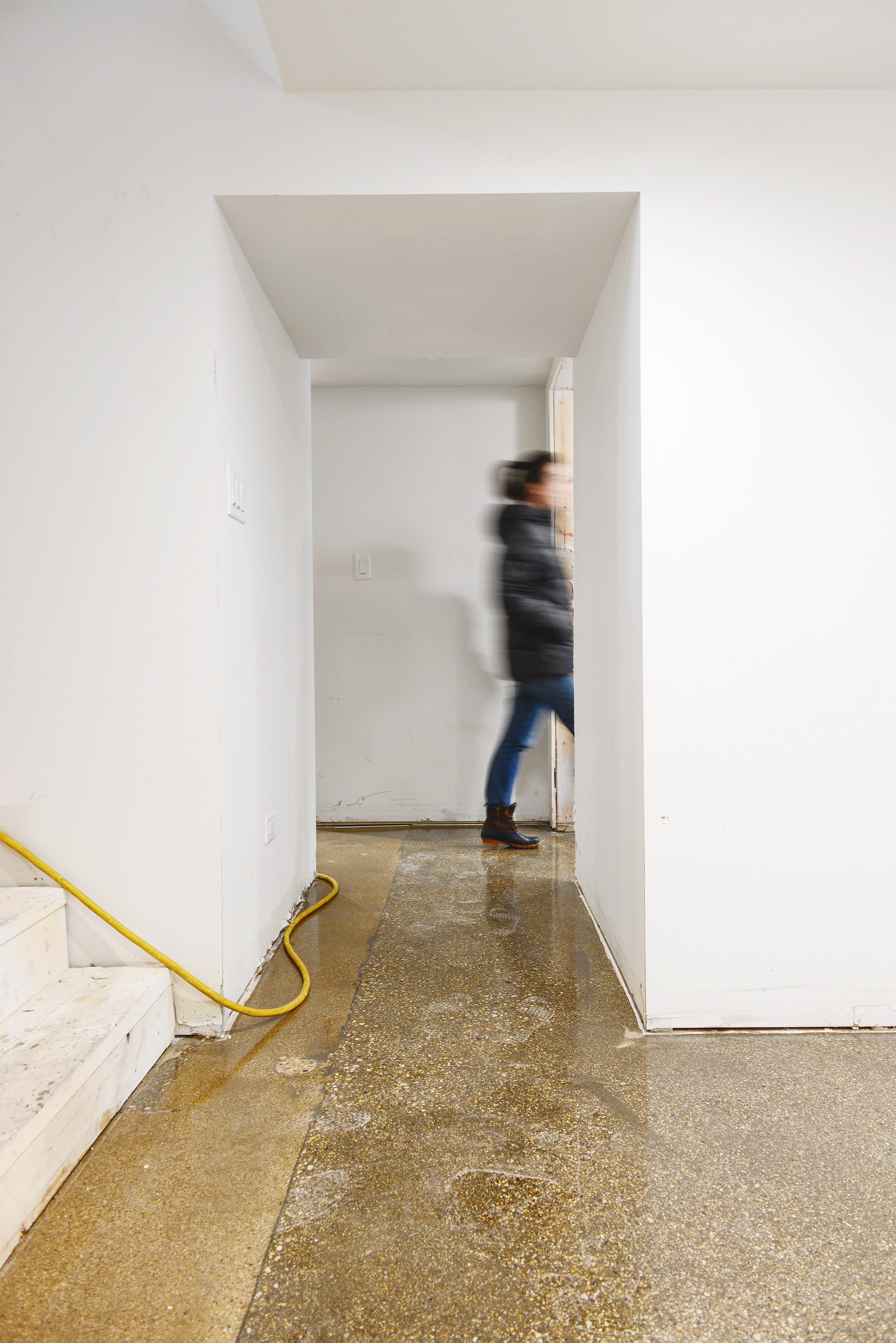 Polished and epoxy coated flooring in a remodeled basement apartment. via Yellow Brick Home