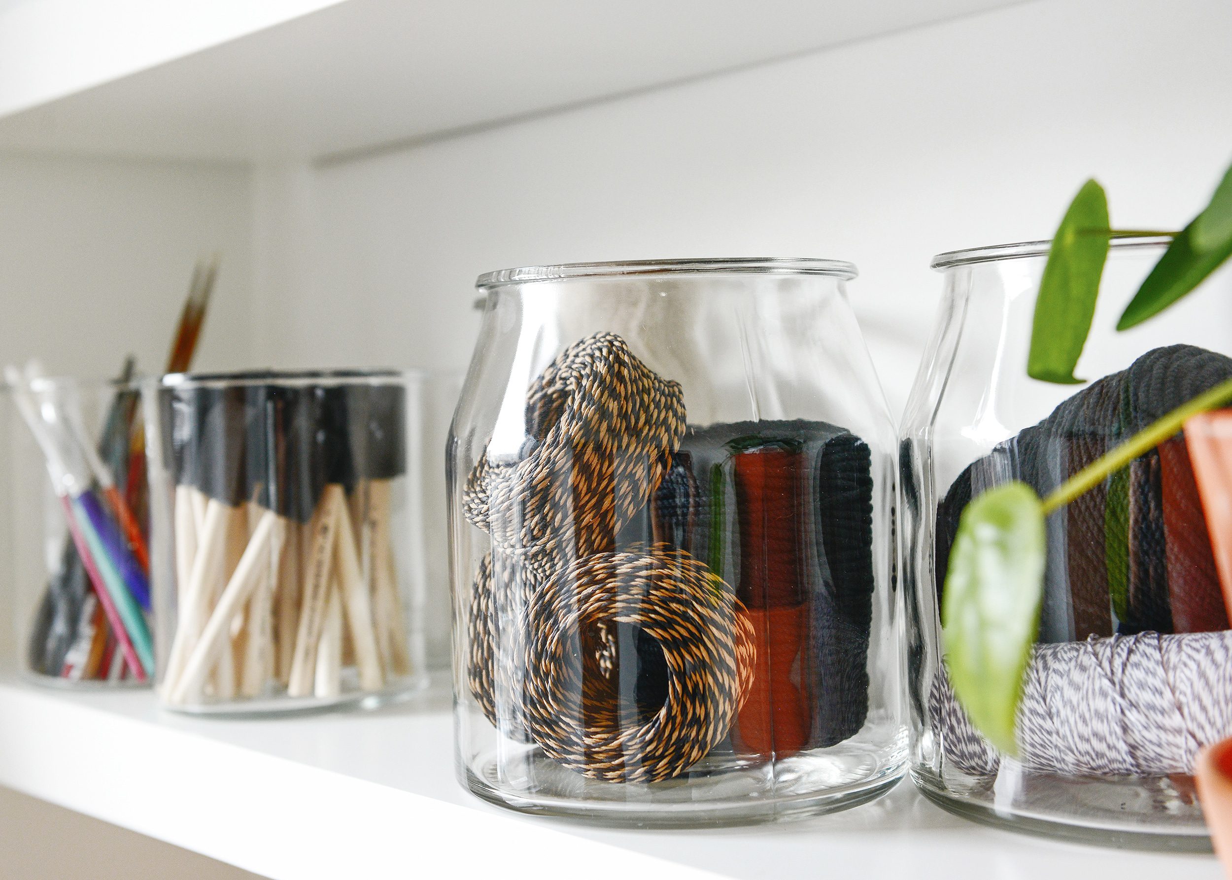 Use clear jars so that you can easily locate where items are | glass jar filled with bakers twine | via Yellow Brick Home