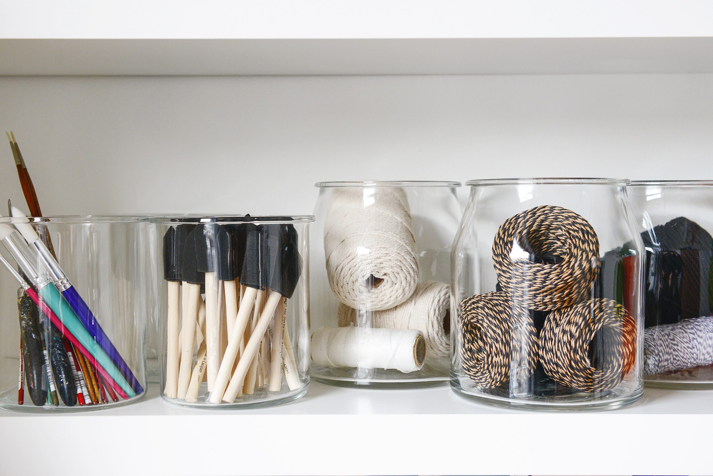 Use clear jars so that you can easily locate where items are | glass jar filled with bakers twine | via Yellow Brick Home