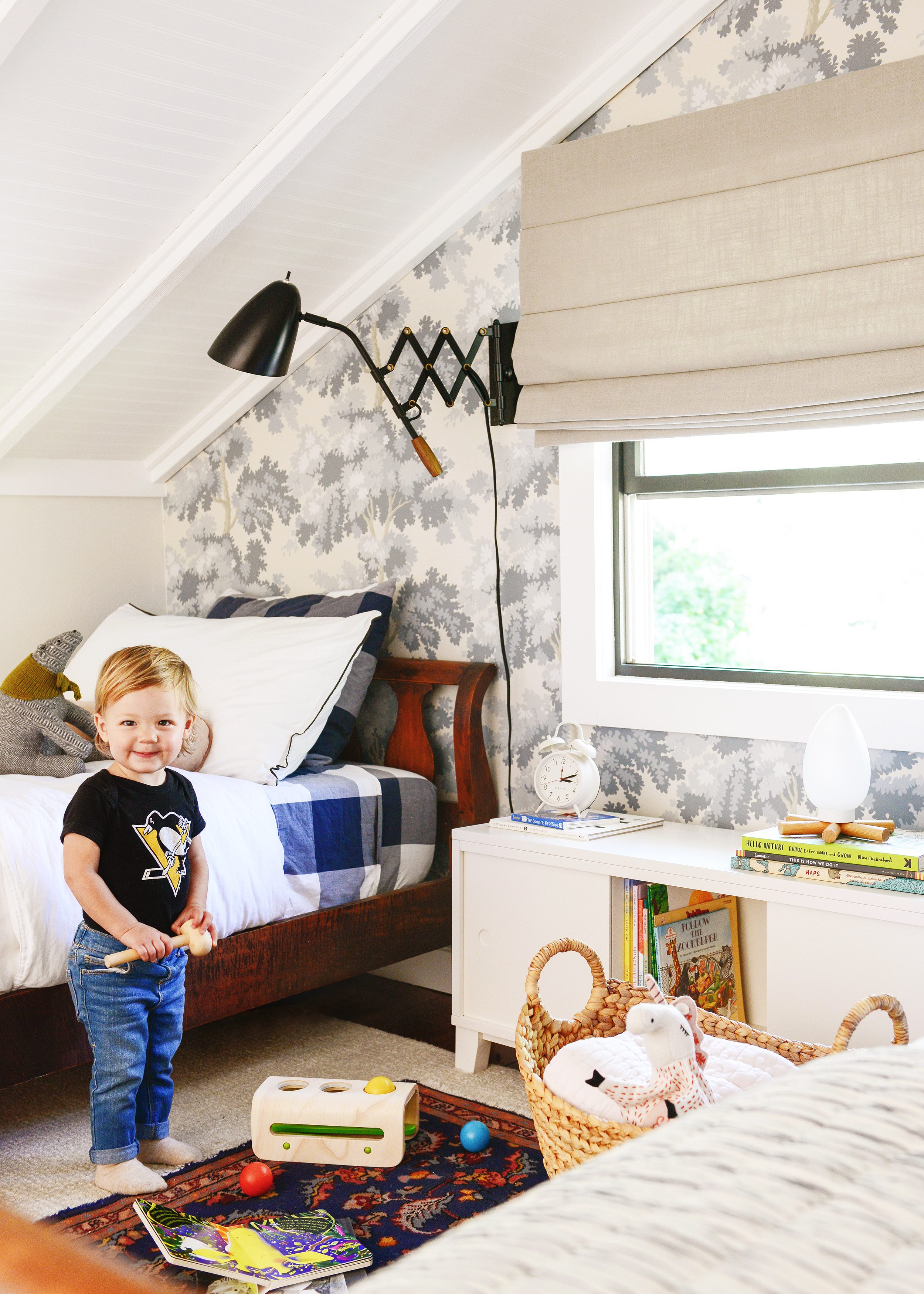 Sweet Lucy playing in the sleeping loft | How we choose, shop and keep our toddler's clothing under control | via Yellow Brick Home