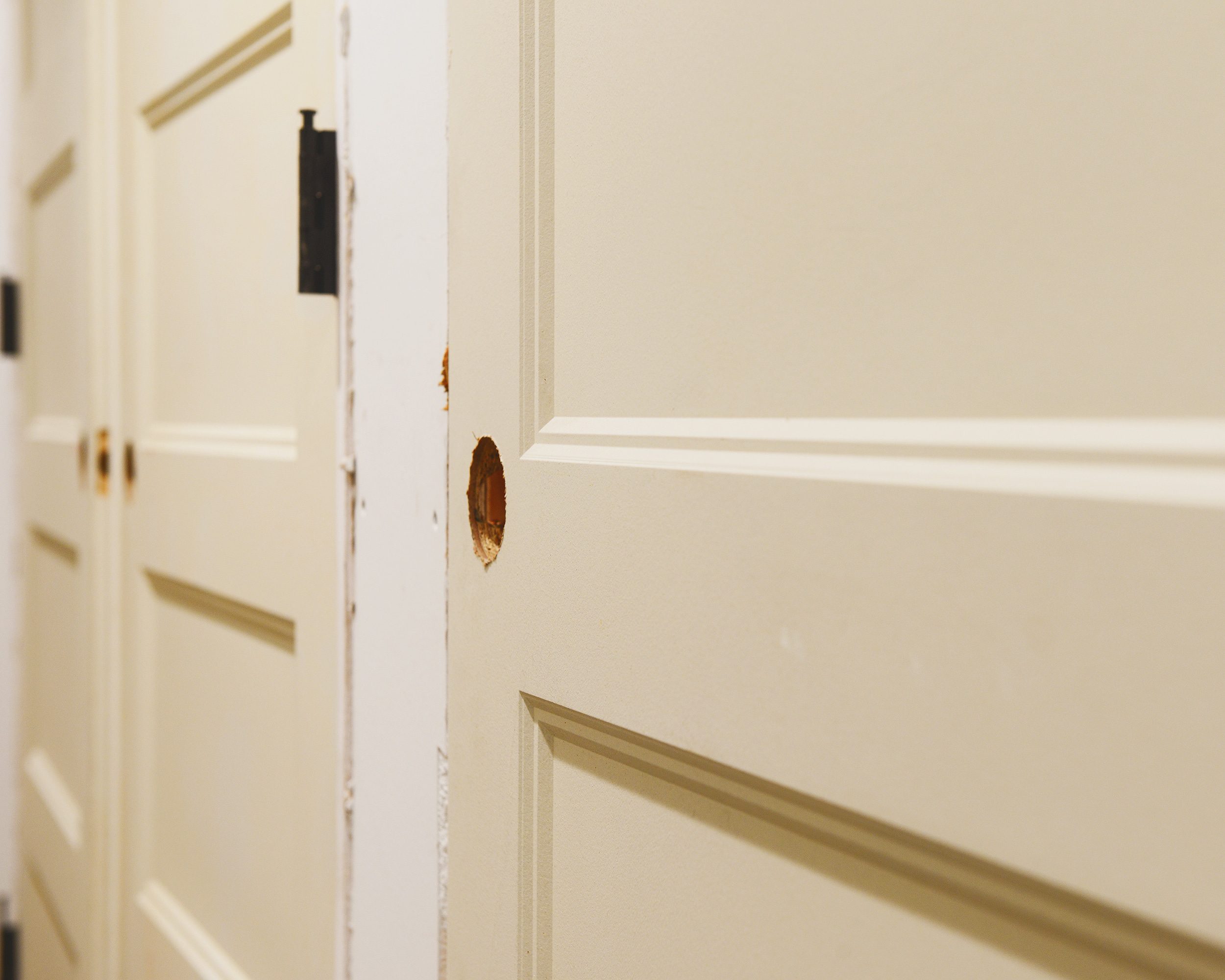 A closeup of a freshly installed door without trim or a handleset // via yellow brick home