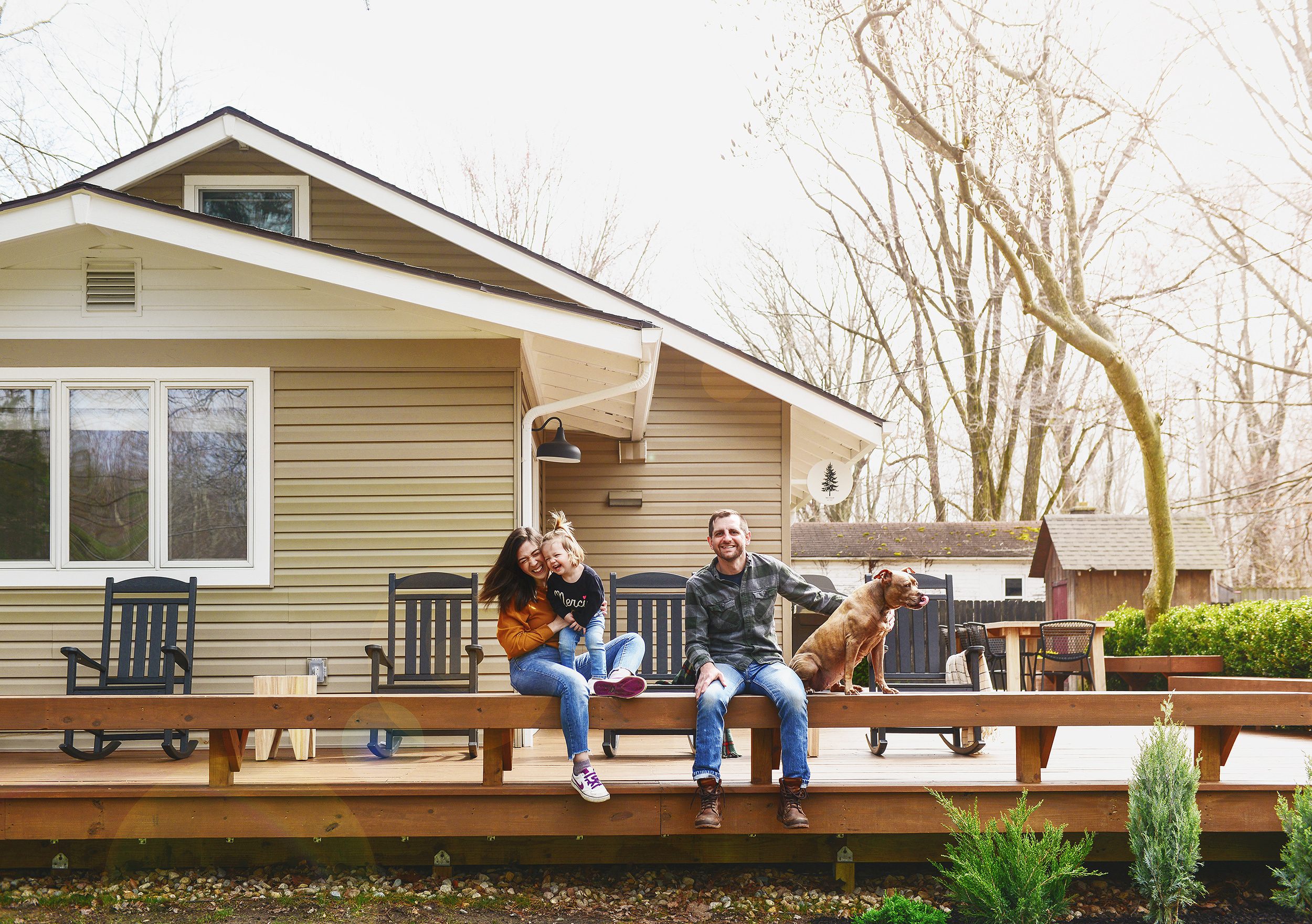 A family photo taken outside at Tree House on our freshly stained deck! via Yellow Brick Home