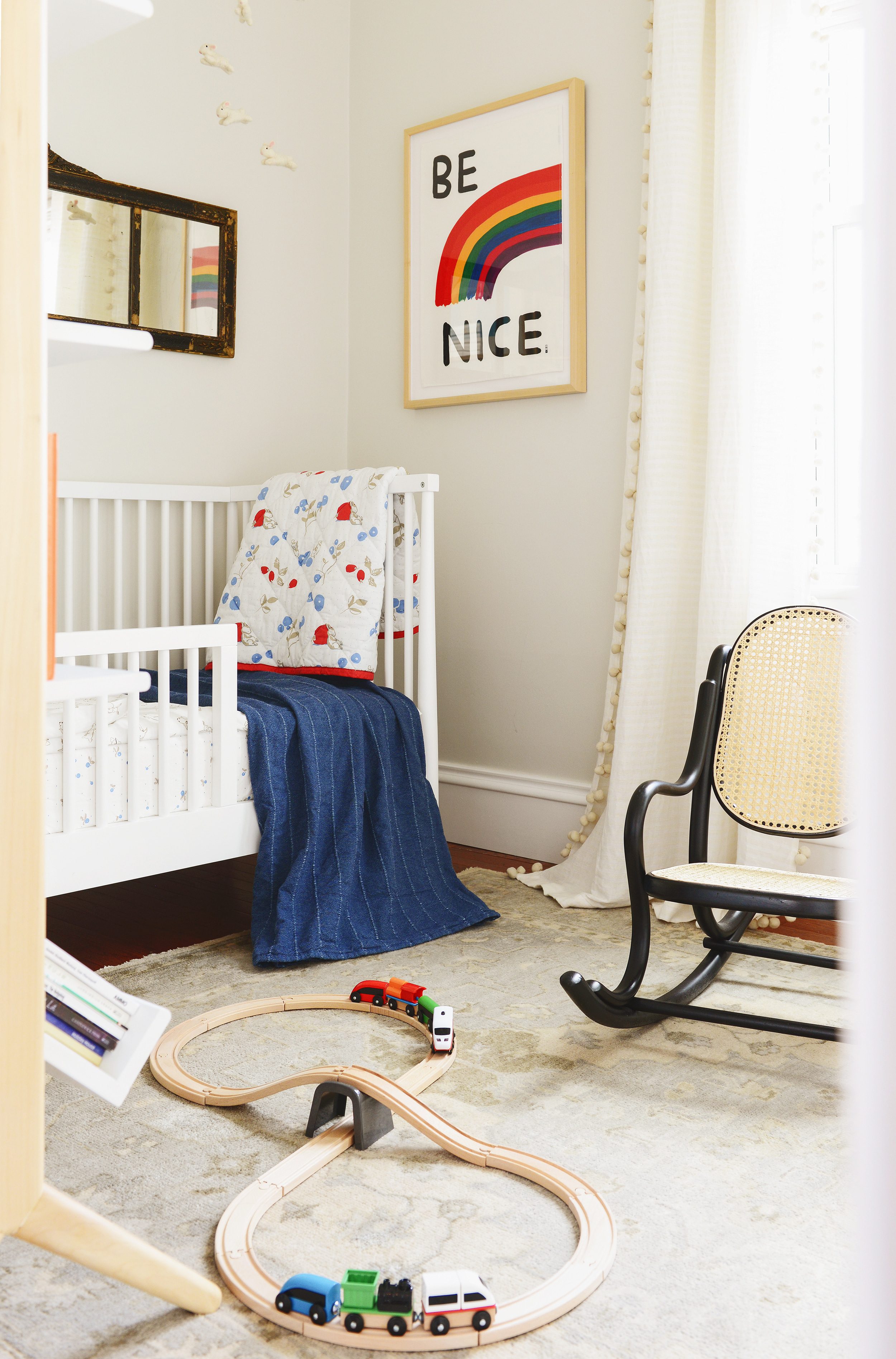 Neutral nursery with pops of color using IKEA bedding | via Yellow Brick Home