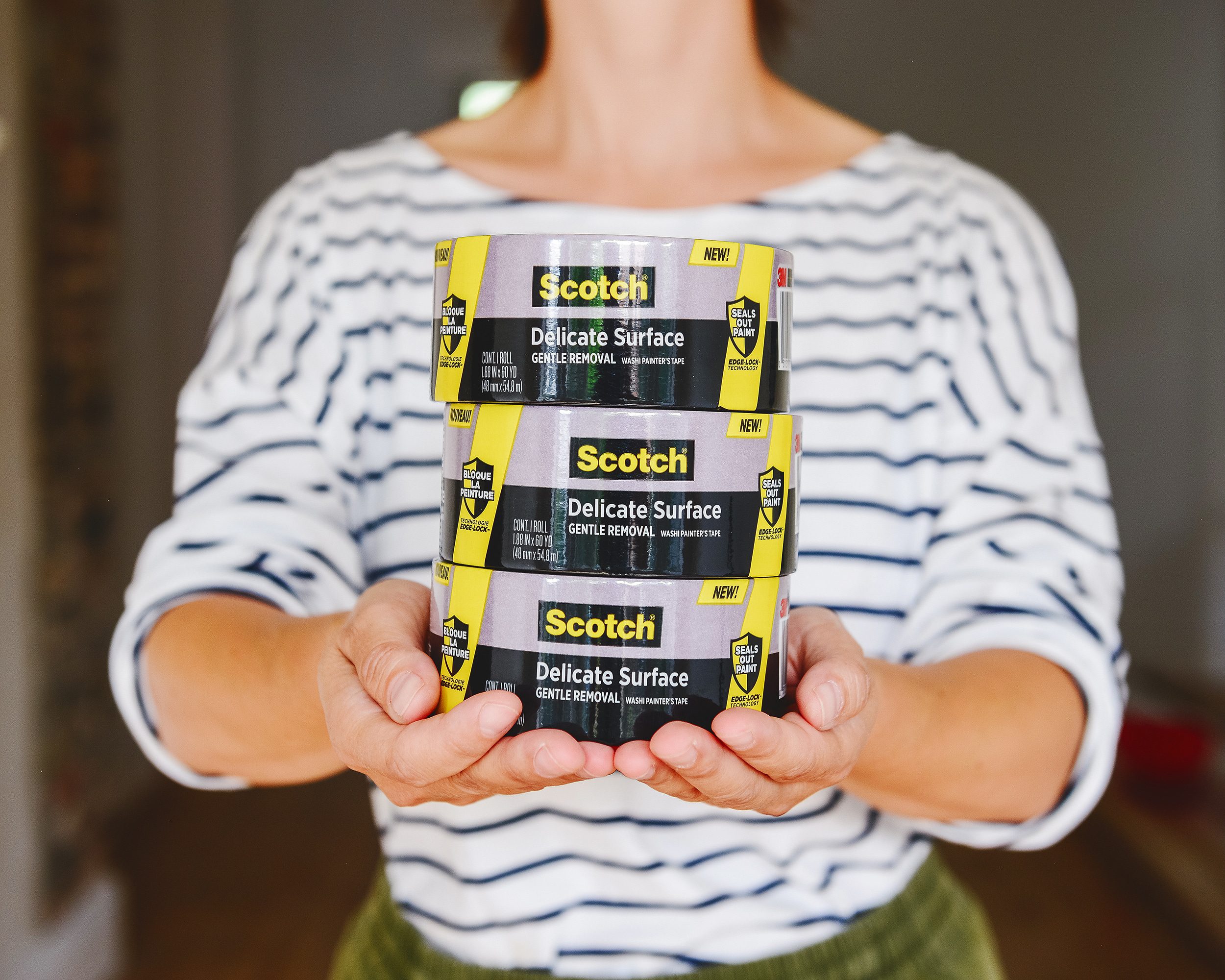 Kim holding a stack of Scotch Delicate Surface painter's tape | via Yellow Brick Home