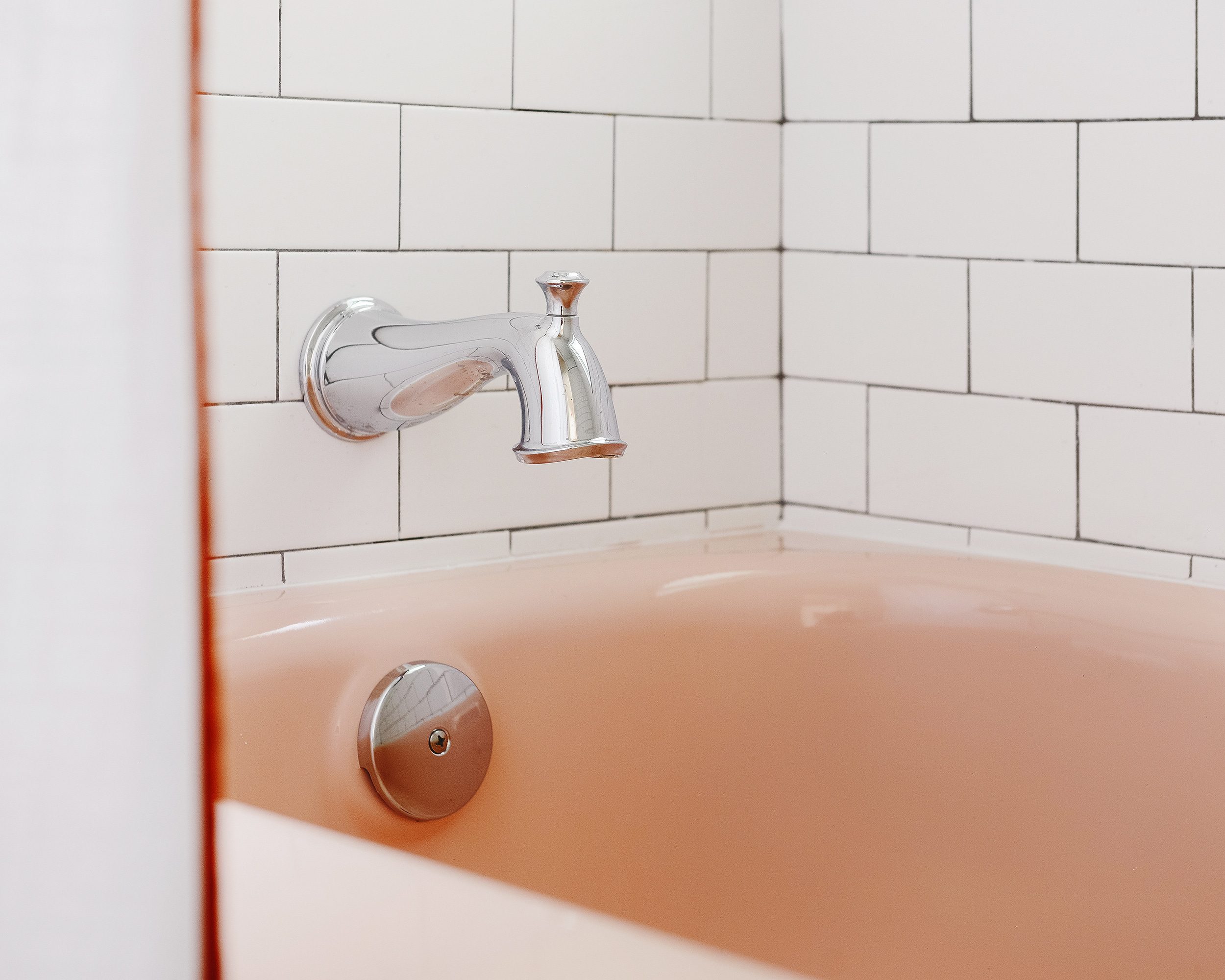 Our freshly reglazed vintage pink bathtub! | via Yellow Brick Home
