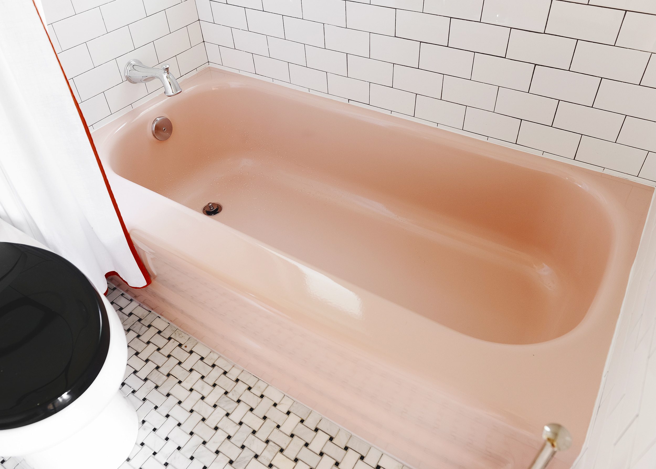 Our freshly reglazed vintage pink bathtub! | via Yellow Brick Home