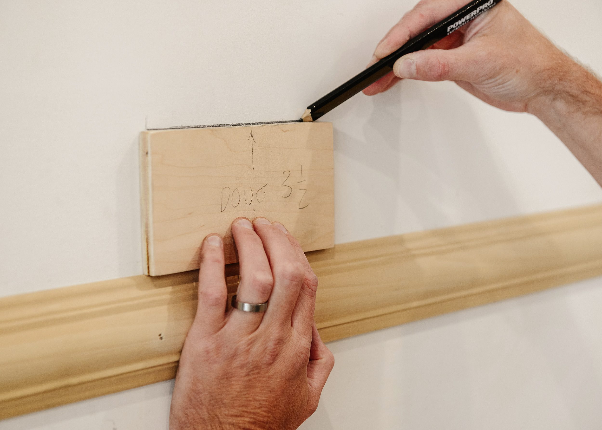 Using a wood 'slug' to install panel molding in the dining room | via Yellow Brick Home