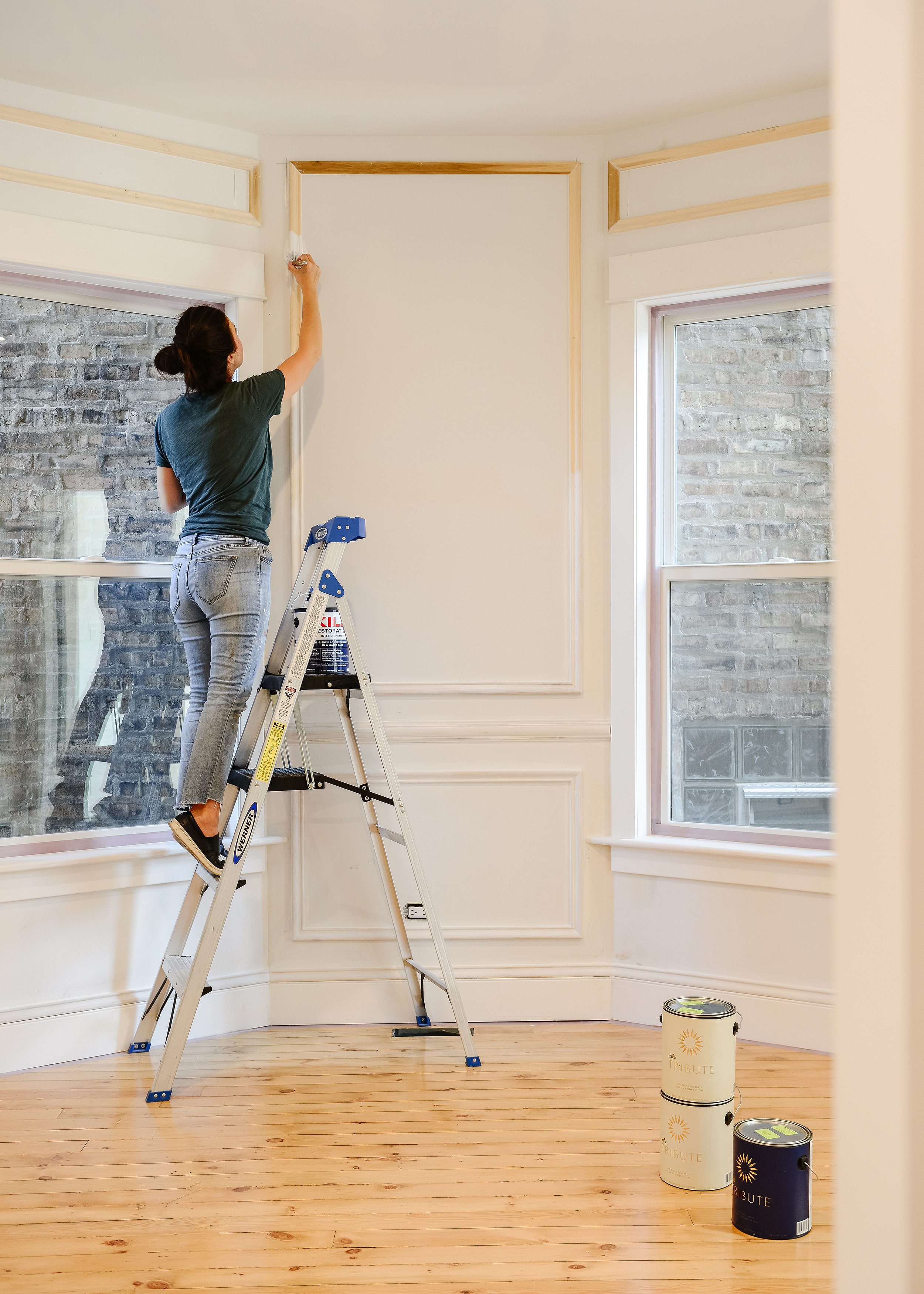 Priming panel molding before we paint the whole room | via Yellow Brick Home
