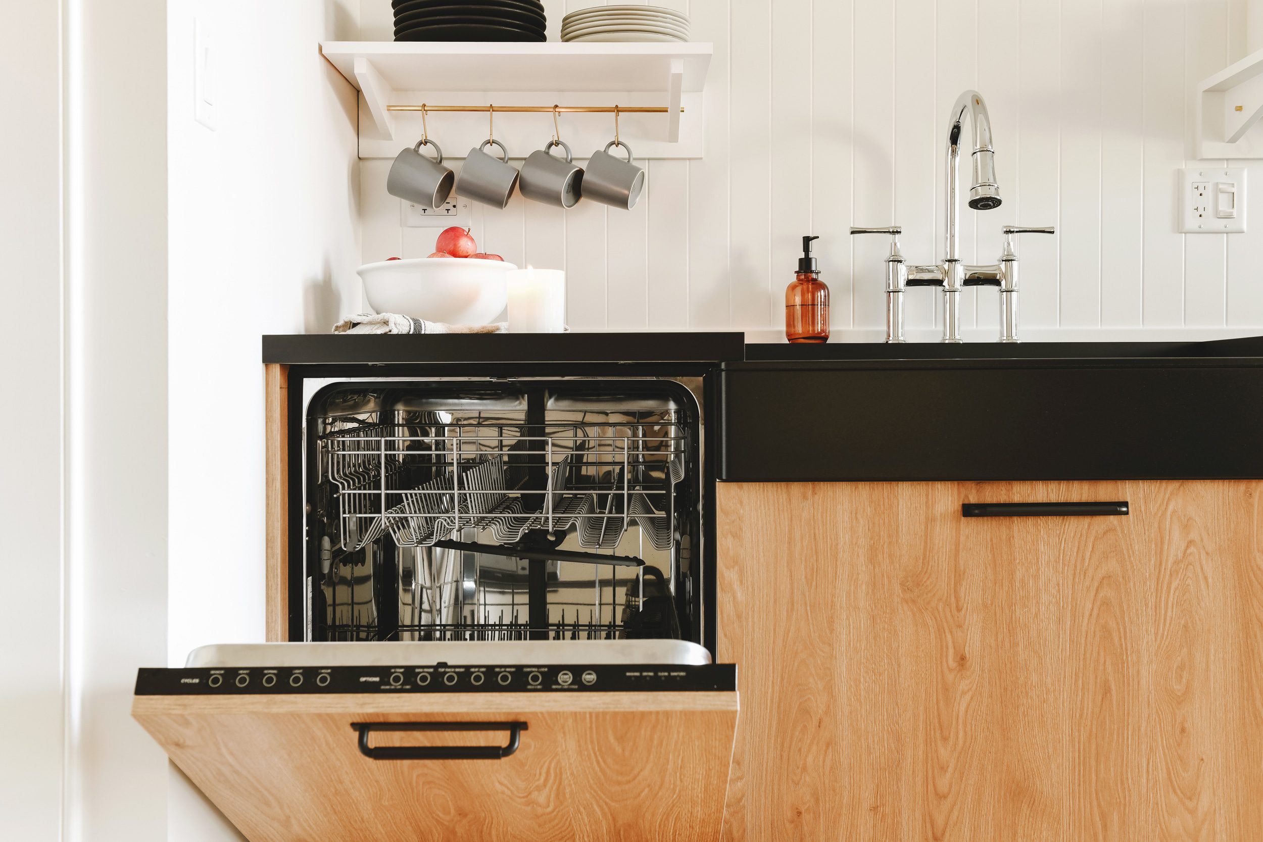 Concealed dishwasher in a compact kitchen | via Yellow Brick Home