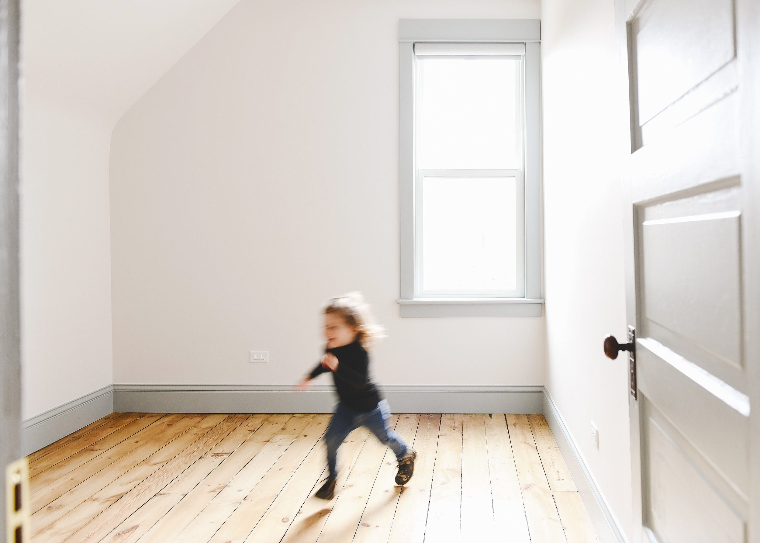 Lucy running across the bedroom at the Two Flat | creating a composite photo, via Yellow Brick Home