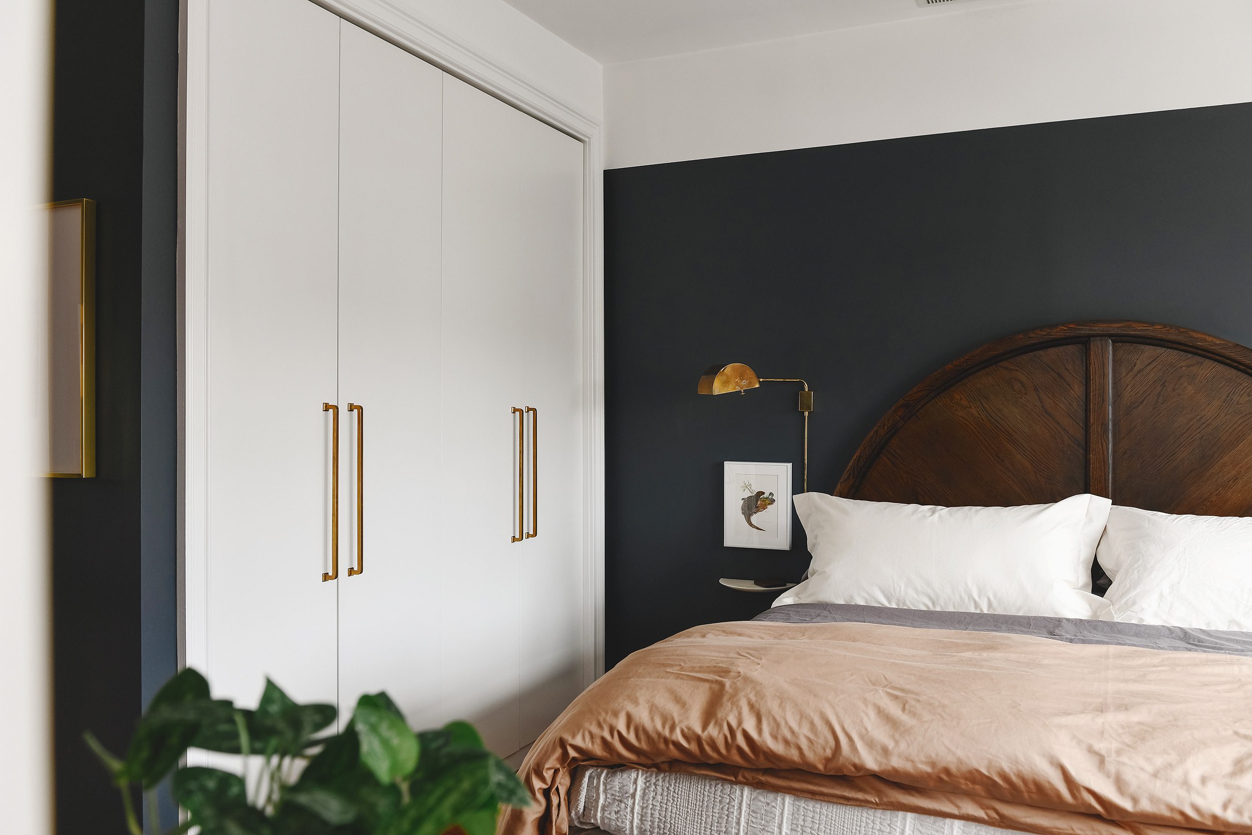 Dark and moody bedroom with wall of closets // via Yellow Brick Home