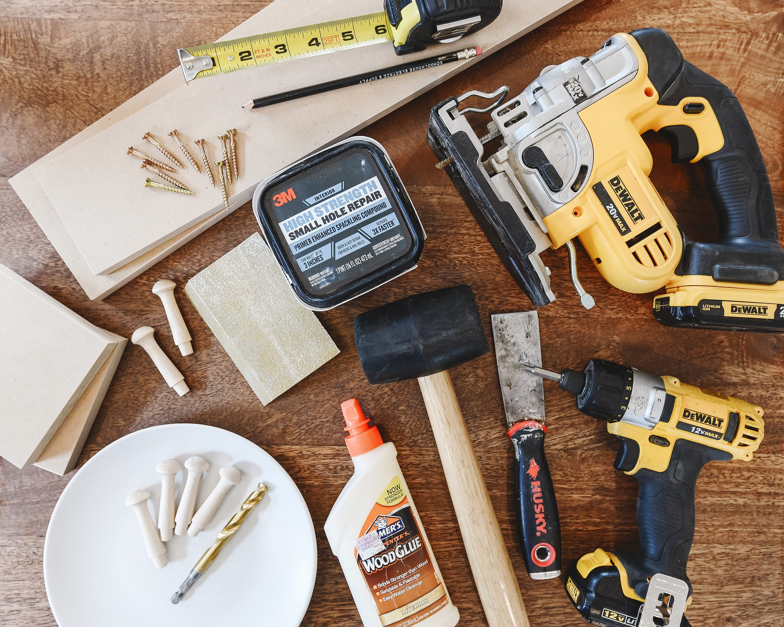 A visual depiction of our tool list for this project including a jigsaw, drill and various other tools // via Yellow Brick Home