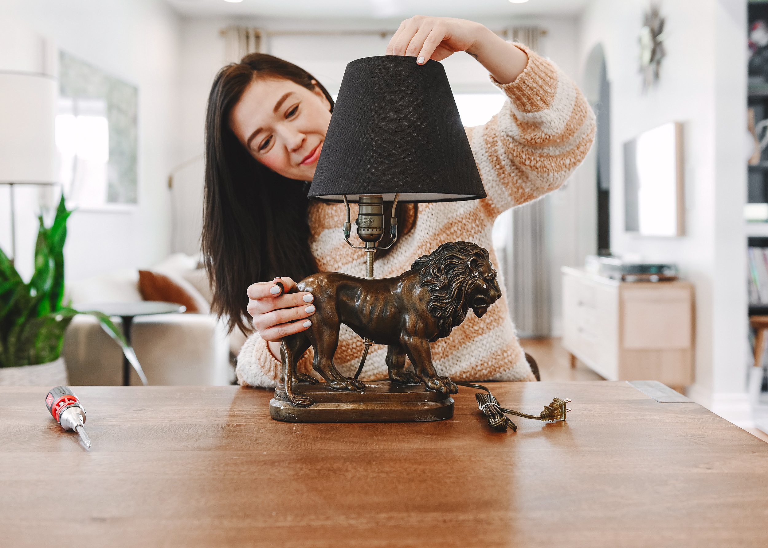 Kim handles the final assembly of the DIY lion lamp  // via Yellow Brick Home