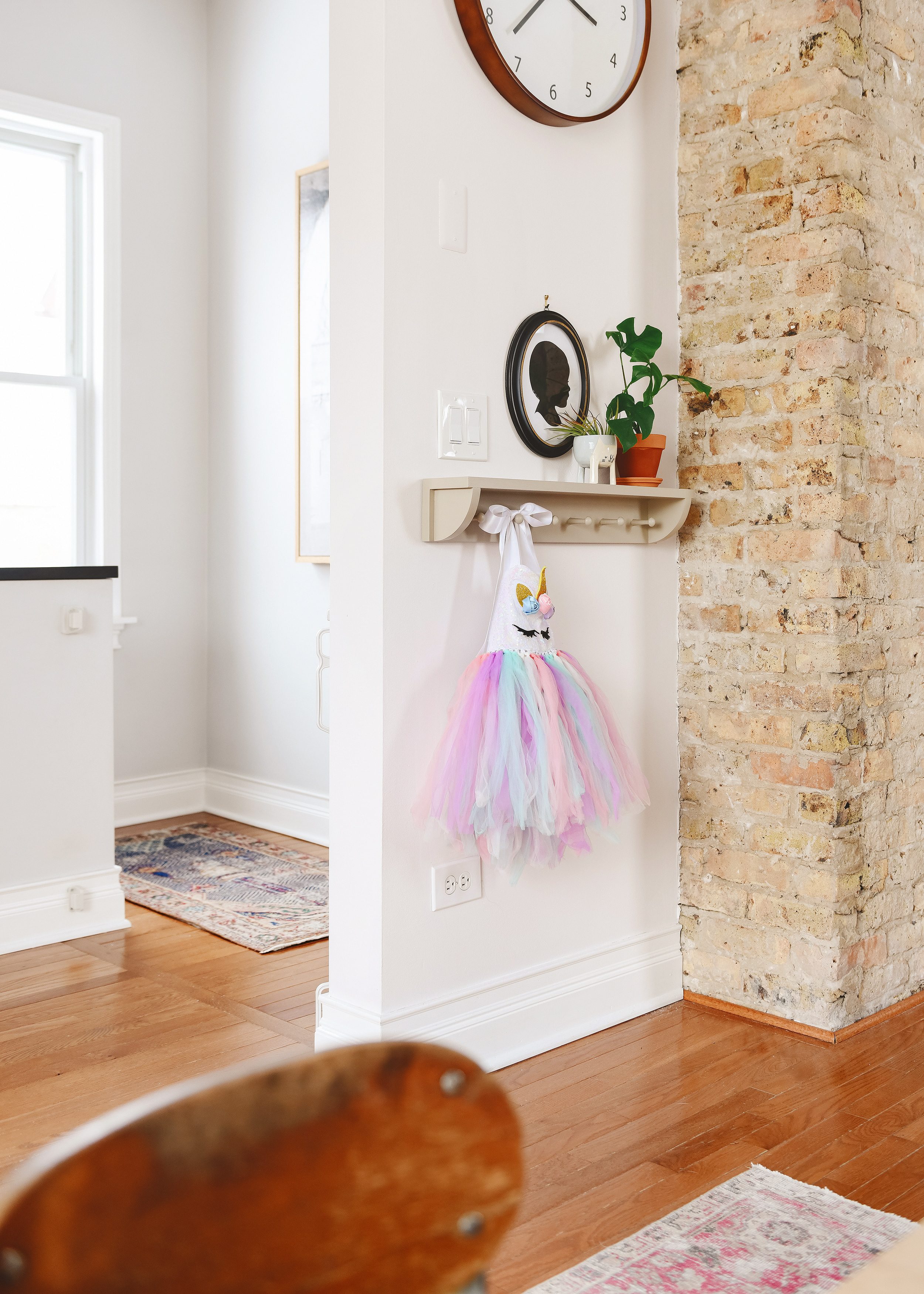 Our DIY peg rail installed as Lucy's dress-up station // via Yellow Brick Home