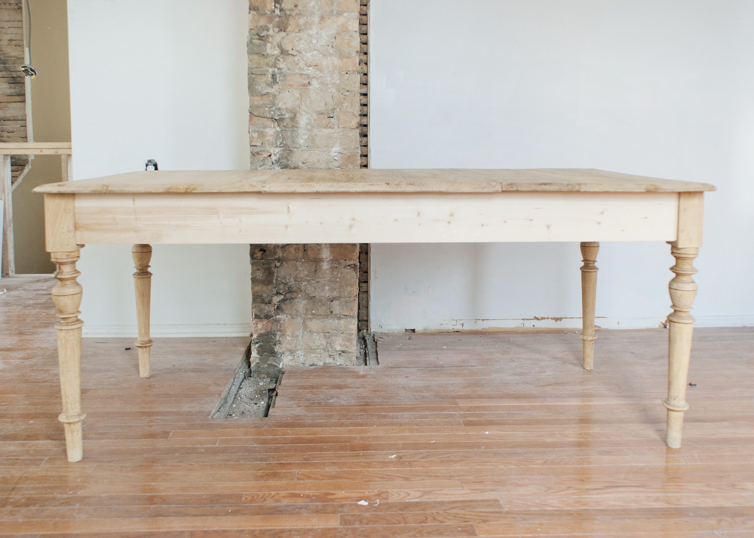 The vintage farmhouse, sanded down and ready for staining // via Yellow Brick Home