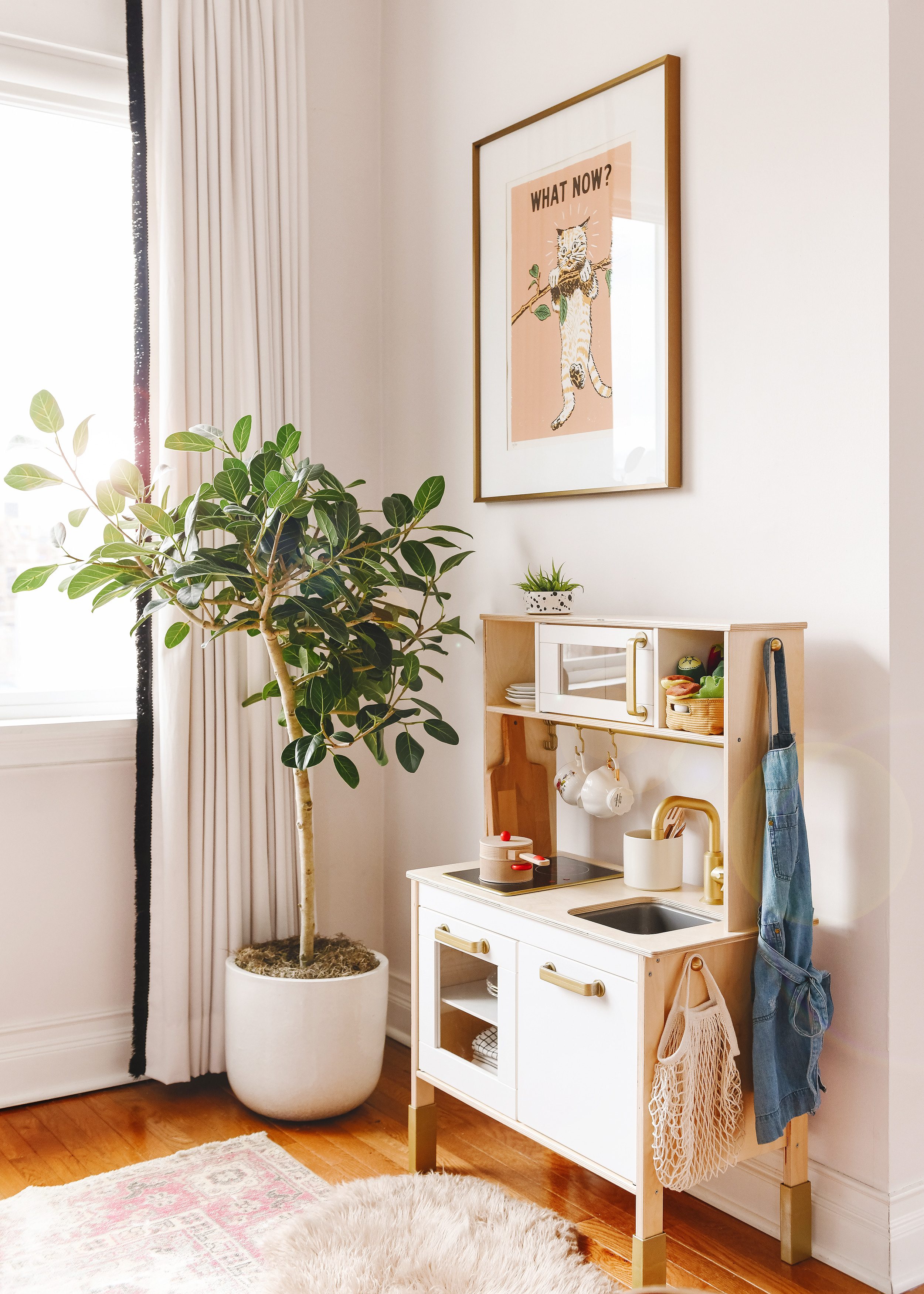 Ficus Audrey tree in the corner of our playroom, next to the play kitchen | via Yellow Brick Home